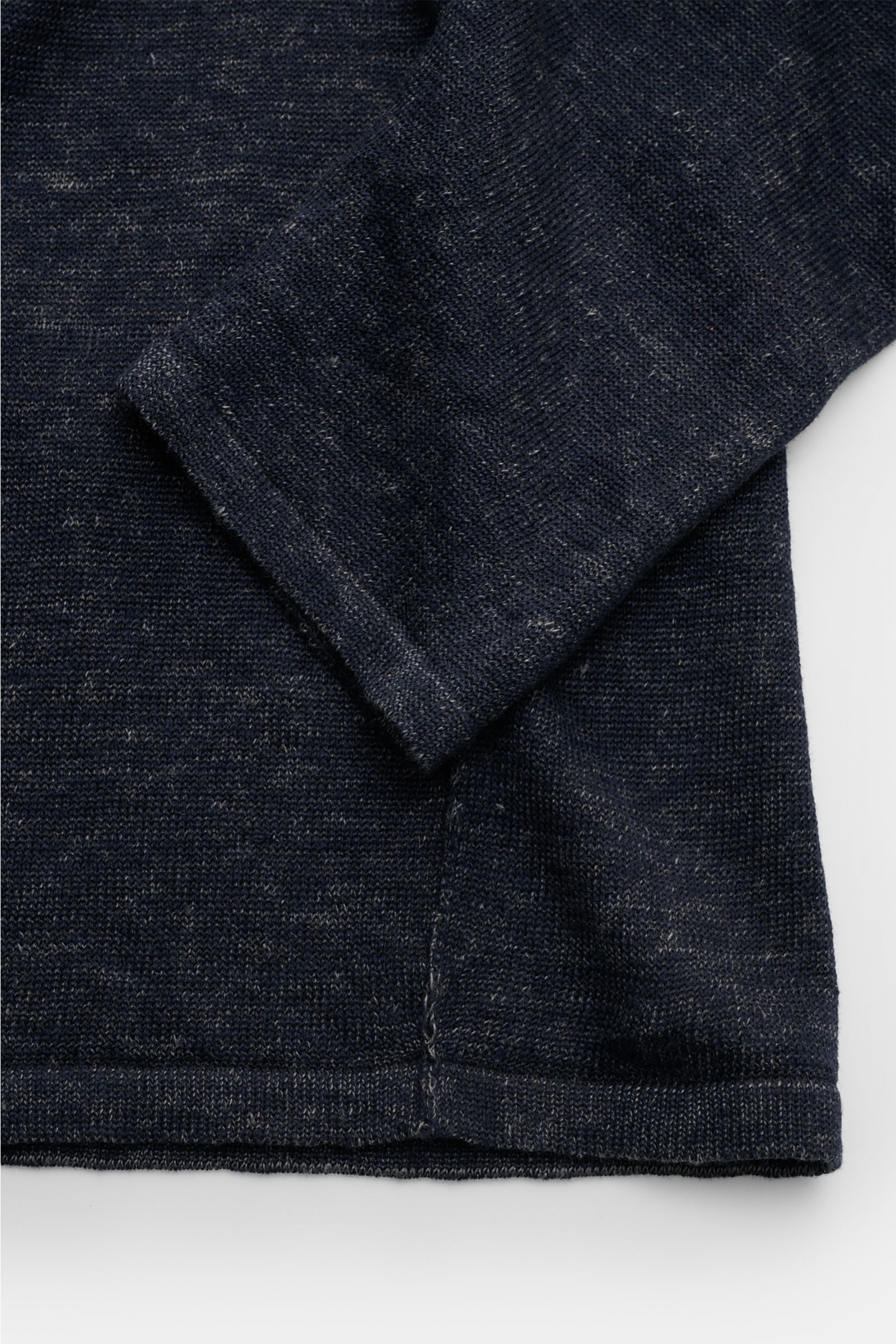Close-up front view of the navy mottled Kiefermann Crew neck jumper 'Jenario' sleeve and hem, showing fine knit and textured linen fabric. Ideal for summer temperatures and layering in the transitional period: The open texture of this KIEFERMANN crew neck