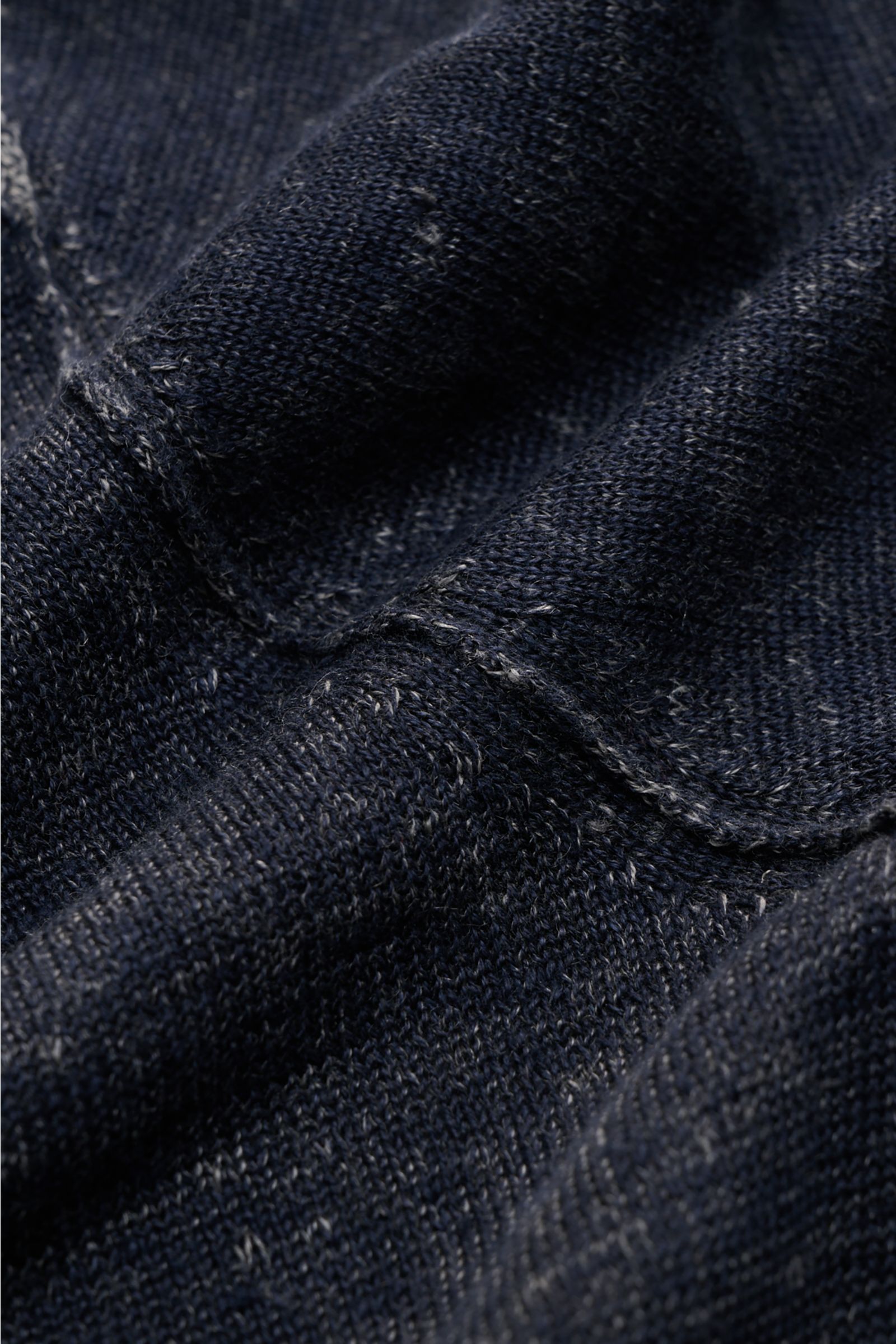 Close-up front-facing view of Kiefermann Crew neck jumper 'Jenario' navy mottled showing fine knit texture and seam detail. Ideal for summer temperatures and layering in the transitional period: The open texture of this KIEFERMANN crew neck jumper creates