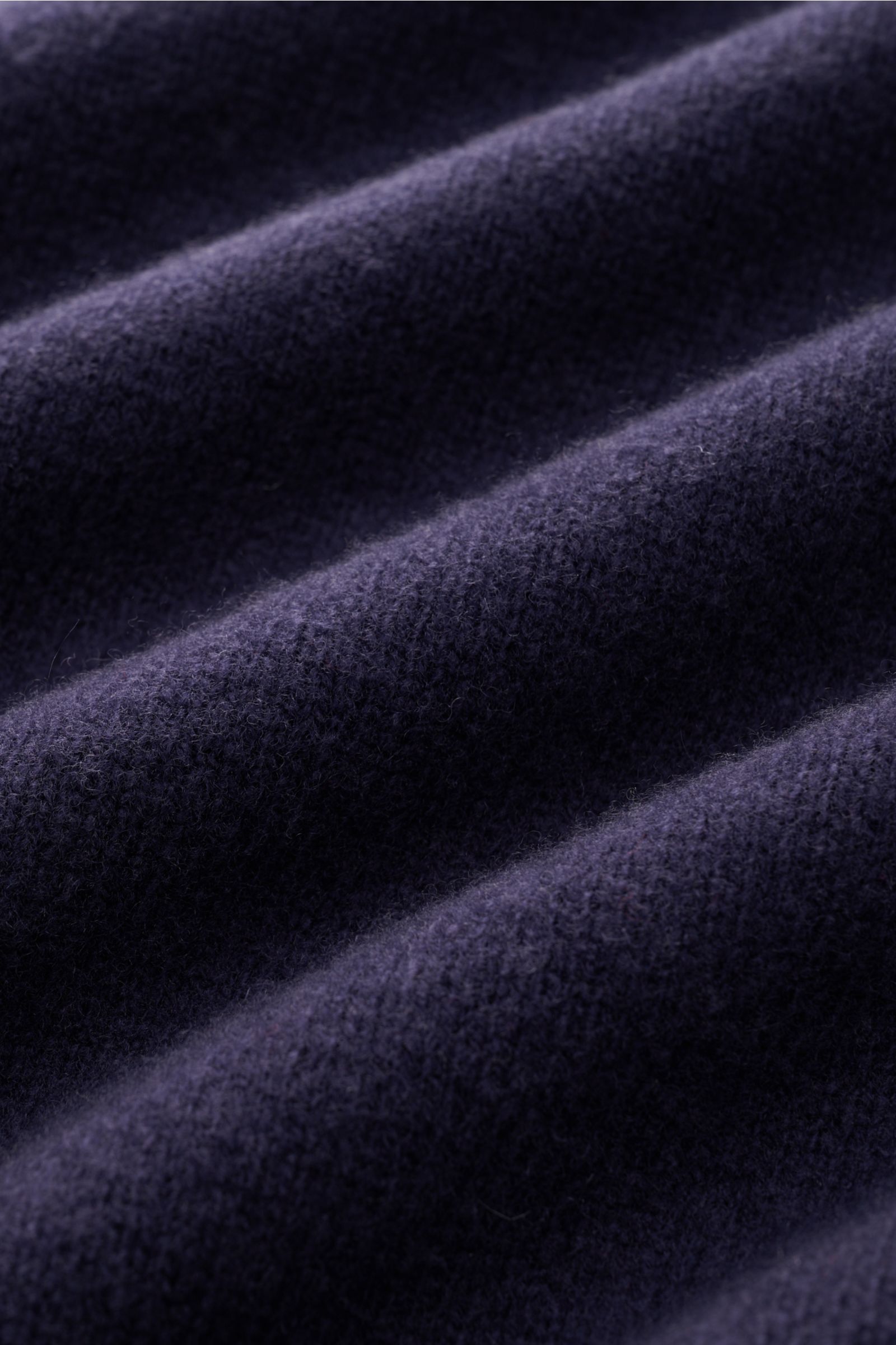 Close-up front view of navy fabric texture showcasing the fine knit and soft feel of the 04651/ A trip in a bag Crew neck jumper 'Piping' navy, cosy and comfortable with a blend of wool and cashmere, regular fit, crew neck, and double-layered seams to kee