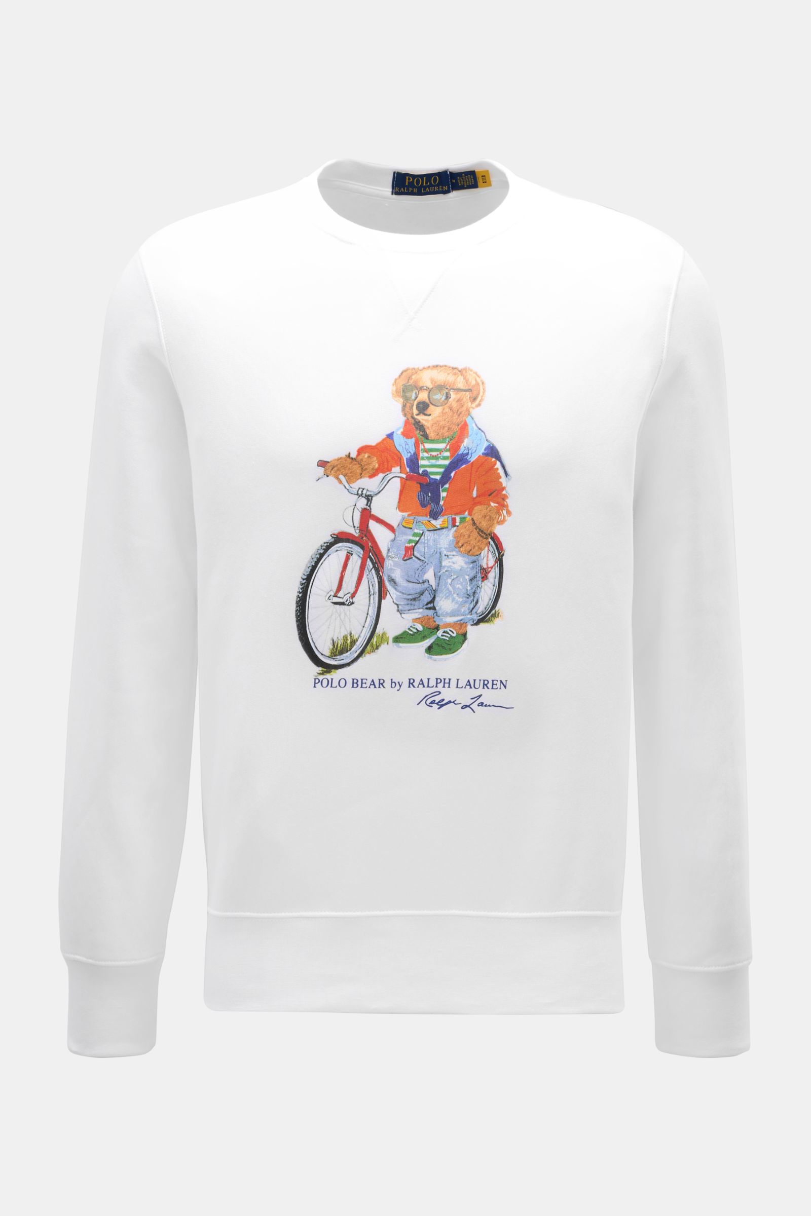 Front view of Polo Ralph Lauren Sweatshirt white featuring Polo Bear print with bike, crew neck, slim fit, cotton-microfiber blend, ribbed bands, and soft interior. The Polo Bear by POLO RALPH LAUREN is back and makes a fashion statement with a bike in