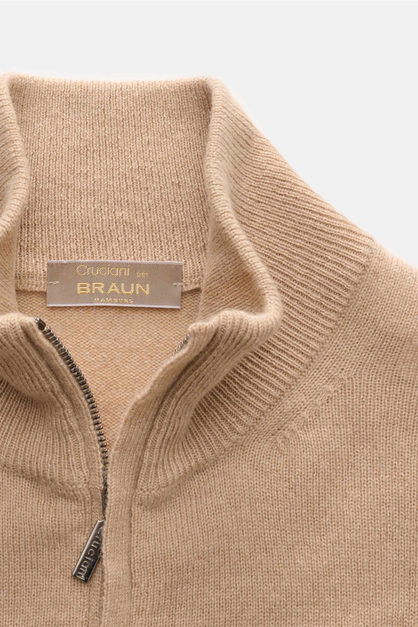 Close-up front view of Cruciani Cashmere half-zip jumper beige showing fine knit, half-zip collar, and elasticated rib knit bands. CRUCIANI has used the finest soft cashmere yarn to create a classic lightweight half-zip jumper that is warm and versatil