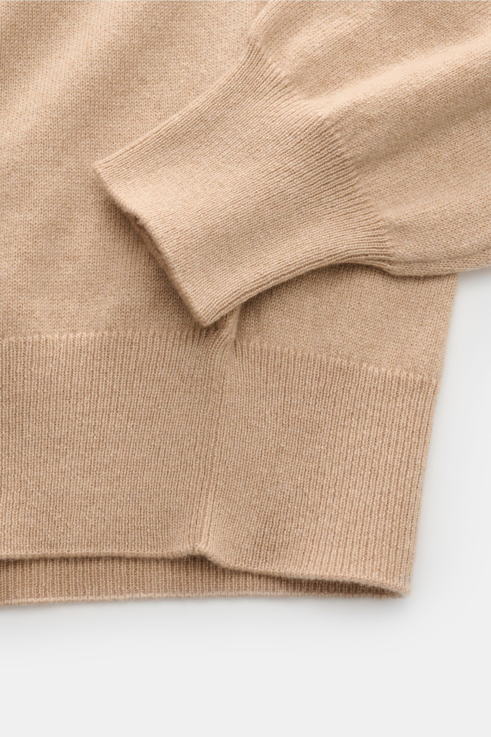 Close-up front view of Cruciani Cashmere half-zip jumper beige showing sleeve and torso details with elasticated rib knit bands.

Description: CRUCIANI has used the finest soft cashmere yarn to create a classic lightweight half-zip jumper that is warm 