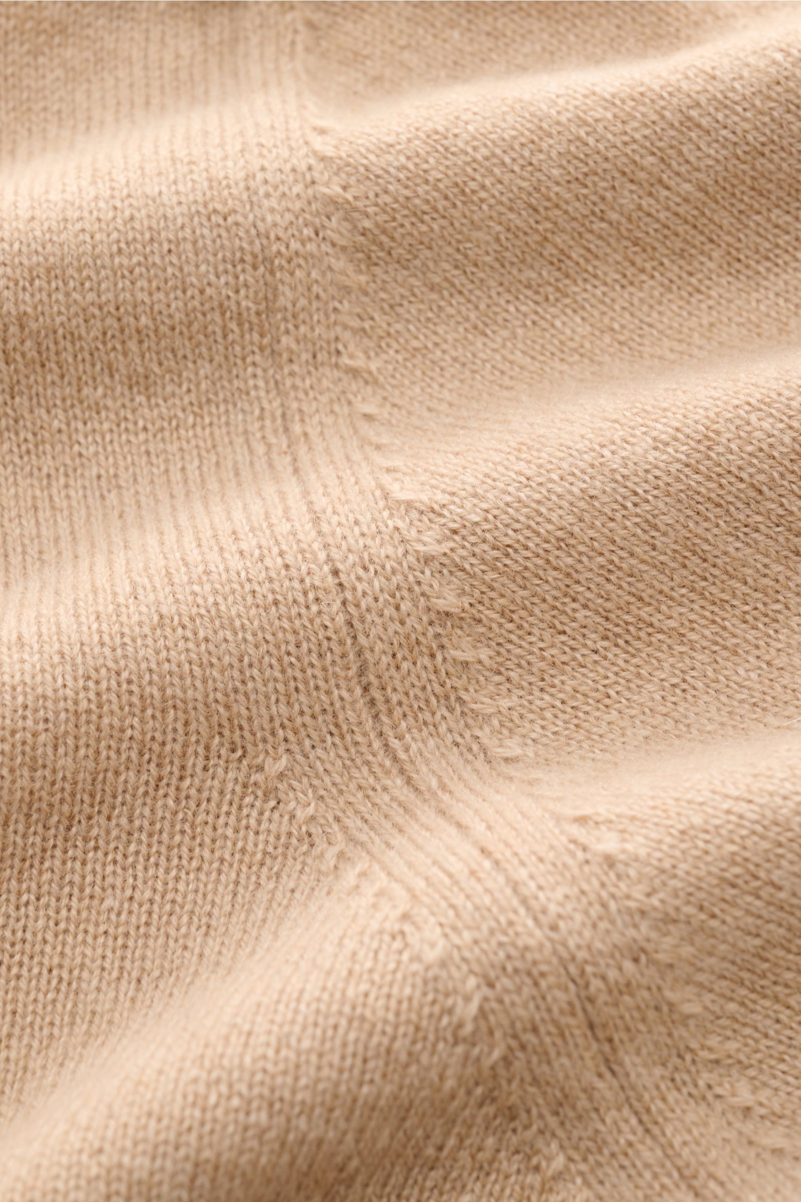 Close-up front view of Cruciani Cashmere half-zip jumper beige showing fine knit texture and soft cashmere yarn details.

CRUCIANI has used the finest soft cashmere yarn to create a classic lightweight half-zip jumper that is warm and versatile.
