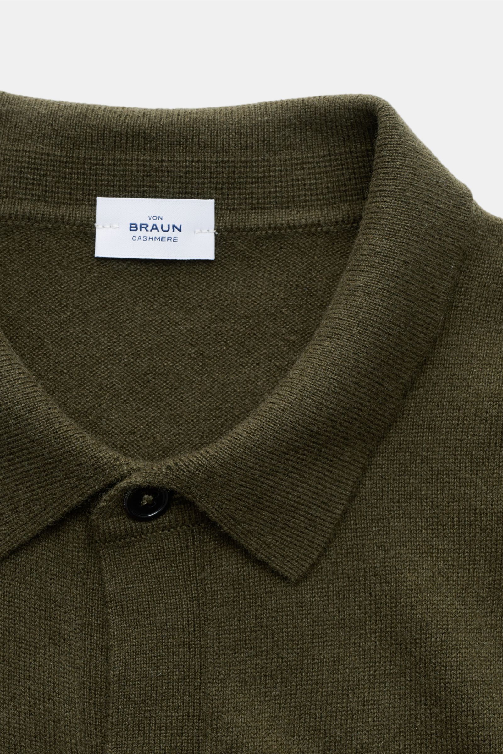 Close-up front view of von Braun Cashmere knit shirt dark olive with classic turn-down collar and smooth button placket.

Luxurious winter essential: This VON BRAUN knit shirt in the finest Mongolian cashmere has a timeless design that offers versati