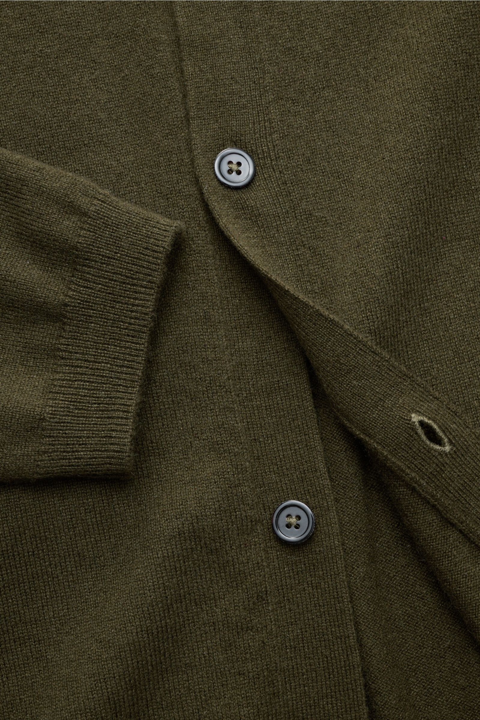Close-up front view of the von Braun Cashmere knit shirt dark olive showing fine knit texture, button placket, and ribbed cuff.

Luxurious winter essential: This VON BRAUN knit shirt in the finest Mongolian cashmere has a timeless design that offers 