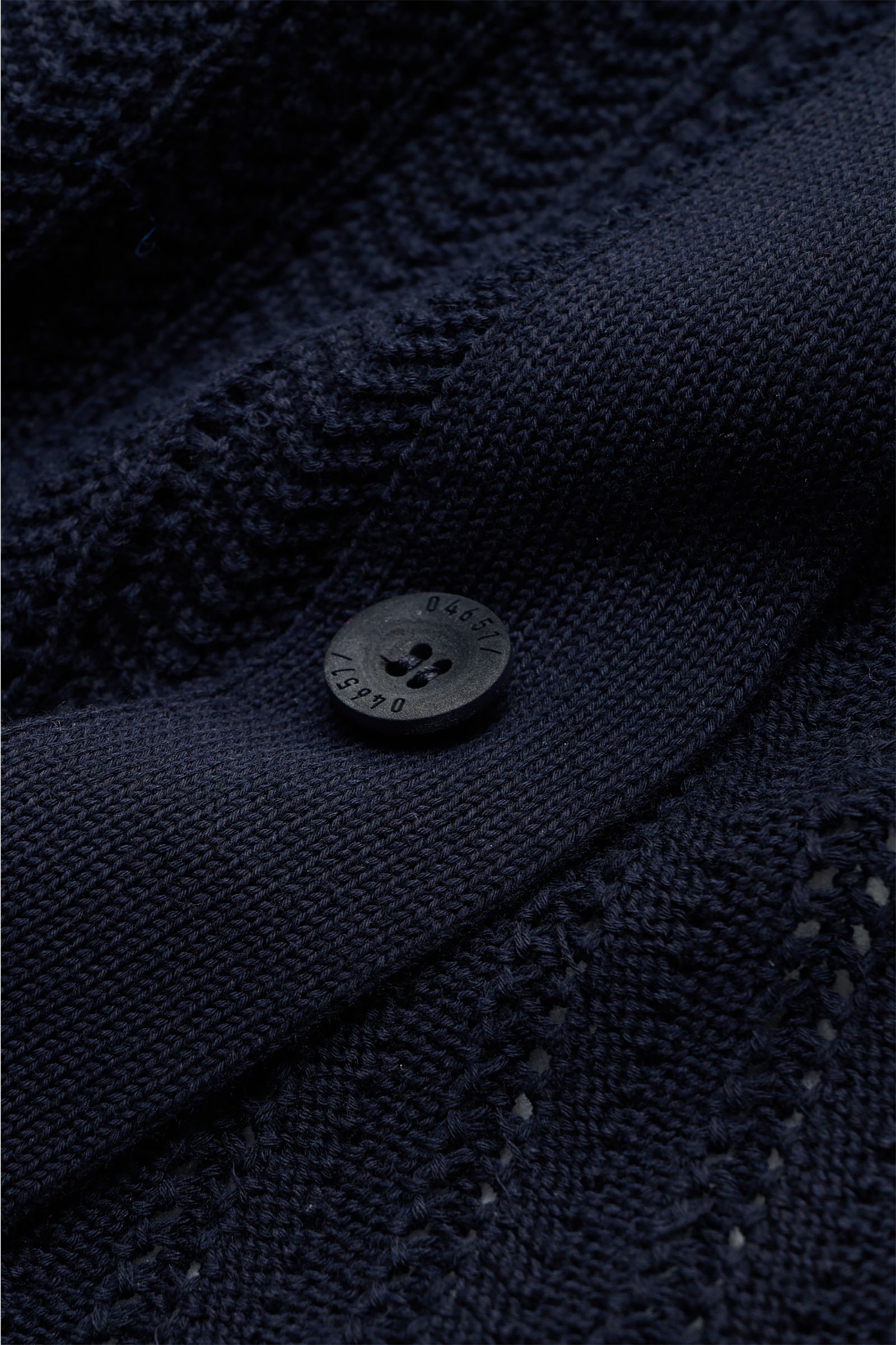 Close-up front view of the navy 04651/ A trip in a bag Short sleeve knit shirt narrow collar navy showing textured knit, button, and ribbed details.

Summery ease: With a casual cut and comfortable cotton, this short sleeve knit shirt by 04651/ A TRIP 