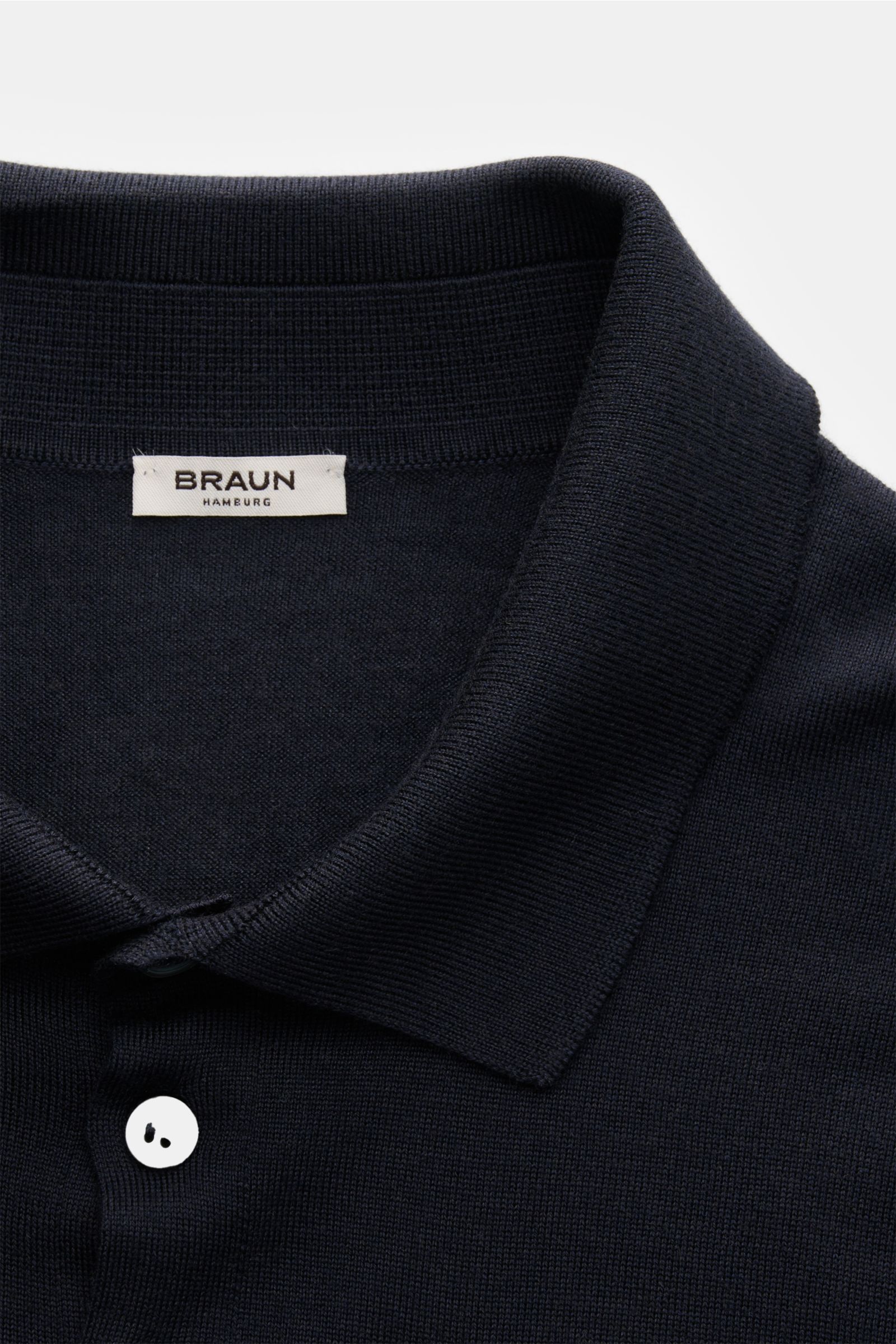 Gran Sasso Fine knit polo navy shown from a close-up top-front perspective, highlighting the soft virgin wool, cashmere, silk blend, slim fit, ribbed bands, signature collar, and smooth four-button placket. Luxury you can feel on your skin: This long slee