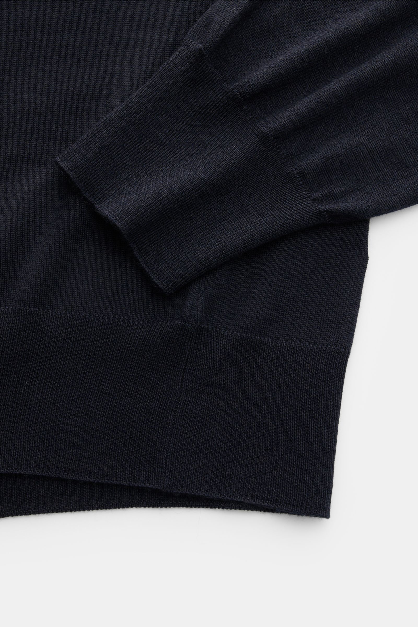 Gran Sasso Fine knit polo navy shown in close-up from a top-down perspective, highlighting the soft, fine knit fabric, ribbed bands, and smooth sleeve cuff. Luxury you can feel on your skin: This long sleeve knit polo by BRAUN HAMBURG has an exceptionally