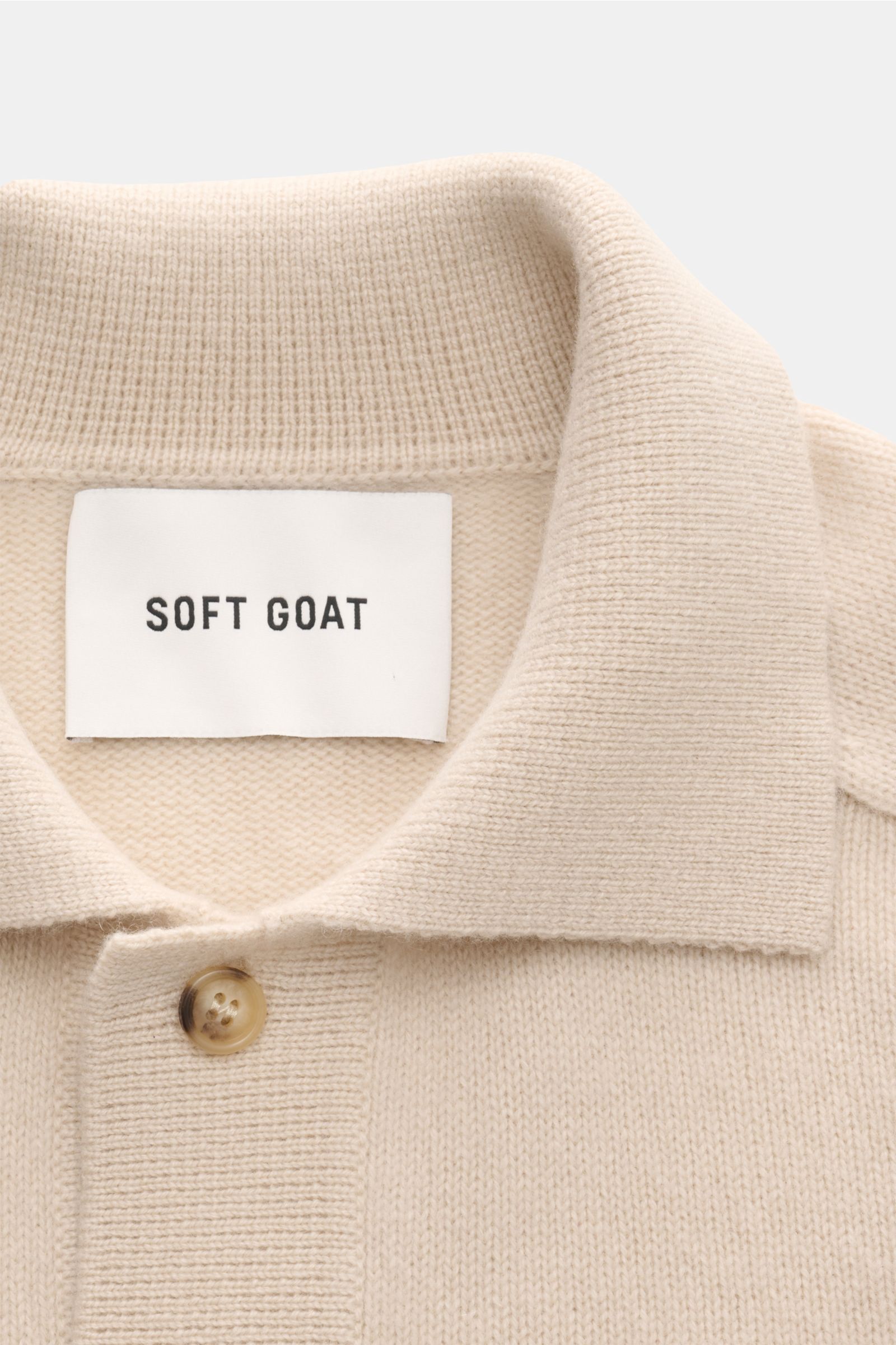 Soft Goat Cashmere cardigan sand close-up from above showing turn-down collar, six-button placket, medium-fine knit, and soft cashmere fabric. Sustainably produced and certified: Young label SOFT GOAT shows how it’s done with their incredibly soft cash