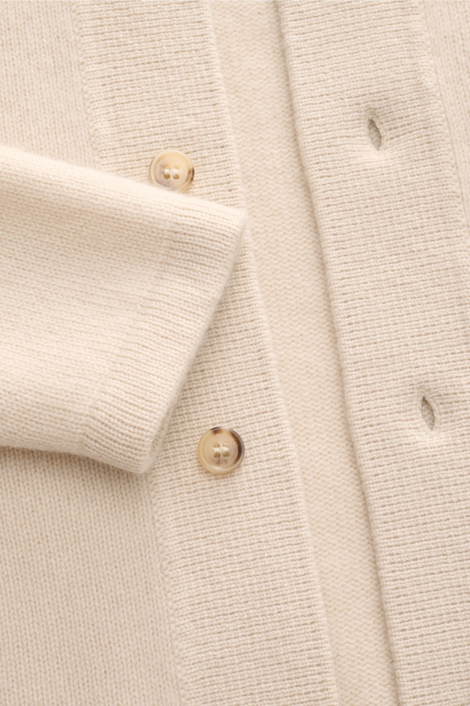 Close-up front view of Soft Goat Cashmere cardigan sand showing slim fit, six-button placket, turn-down collar, raglan sleeves, and wide ribbed bands in sustainable cashmere.