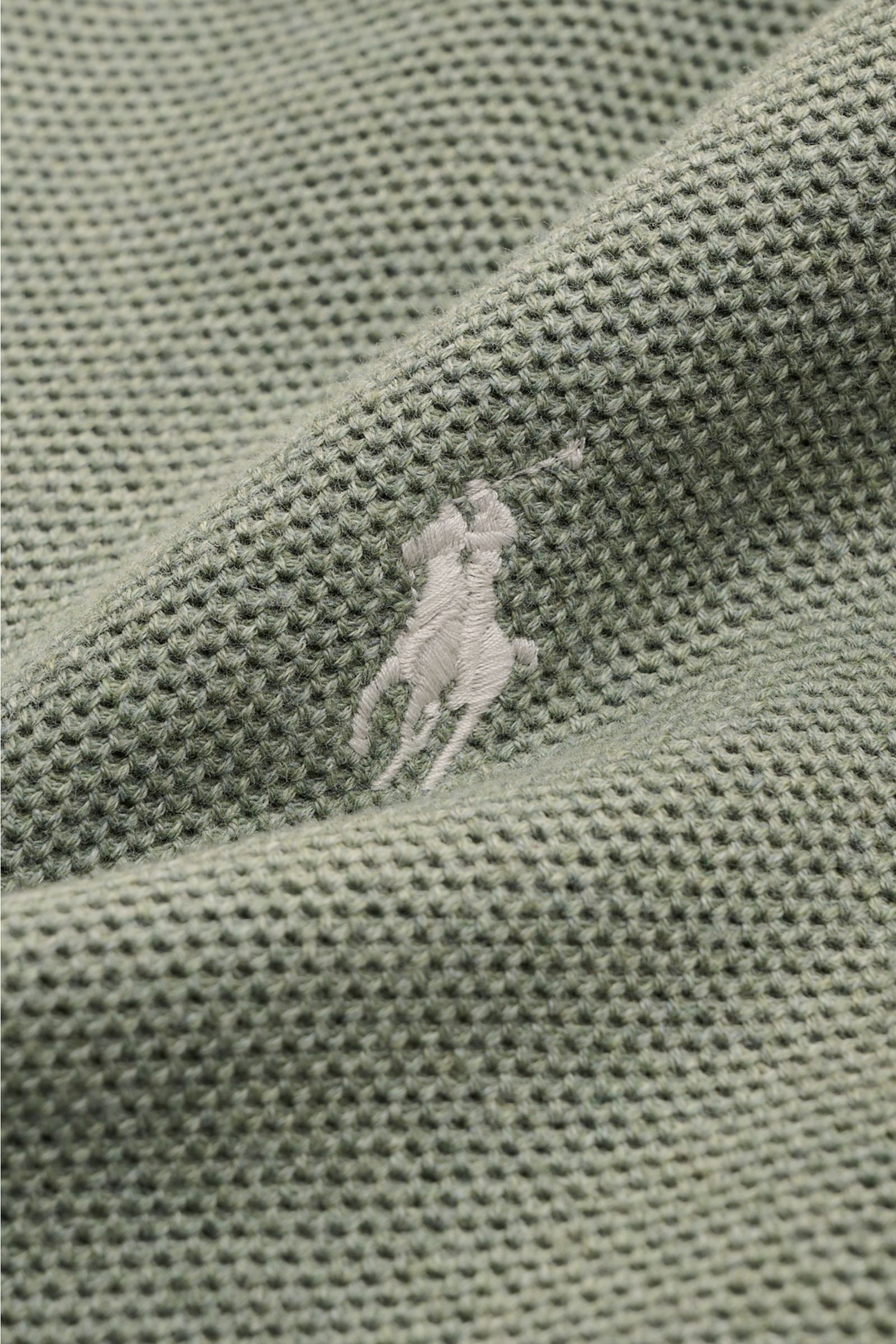 Close-up front view of Polo Ralph Lauren Half-zip jumper mint green showing medium-fine knit texture and tonal polo player stitching on chest, made of pure cotton with a slightly robust touch and comfortable ribbed bands. 

A essential for mild days: T