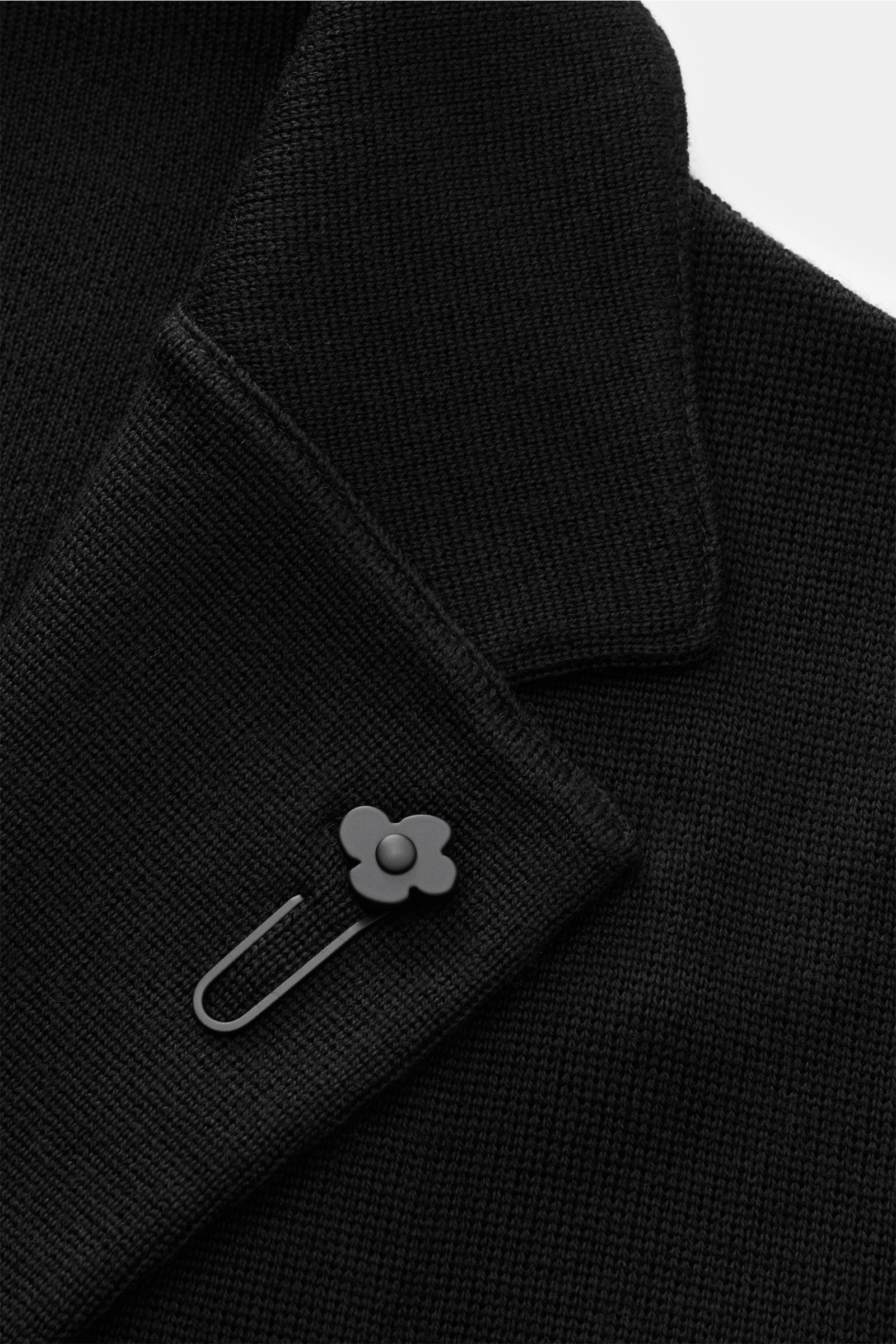 Close-up front view of Lardini Knit blazer black lapel showing fine pure wool knit texture and signature flower pin.

Description: With a classic silhouette and made from pure wool, this stylish knit blazer from LARDINI adds style and personality to yo