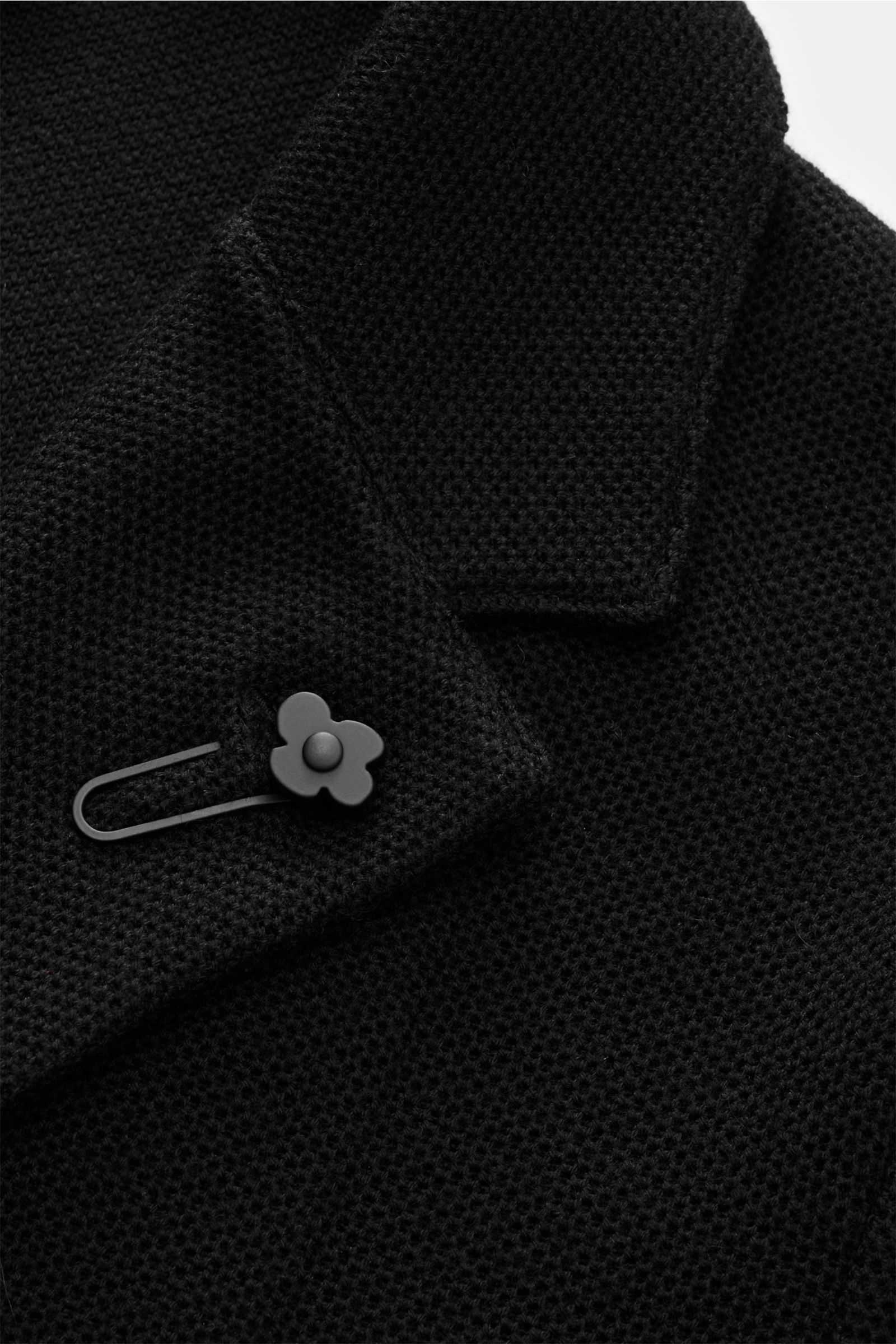 Close-up front view of Lardini Knit blazer black showing finely textured wool, silk, and cashmere knit, soft feel, slim fit, two-button style, lapel with signature flower pin. 

Stylish knitwear with character: This fitted knit blazer by LARDINI in a l
