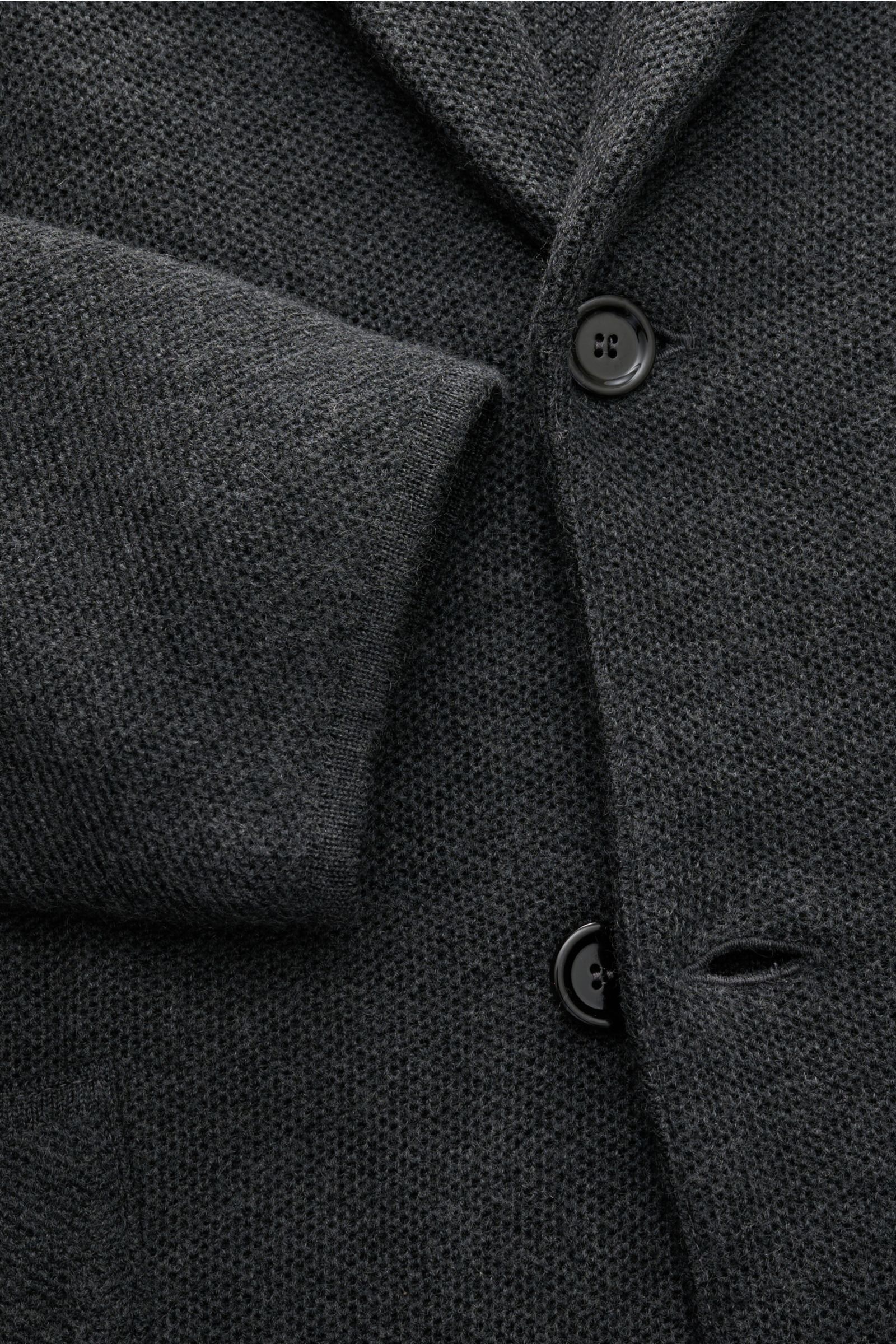 Close-up front view of Lardini Knit blazer dark grey mottled, showing textured wool-silk-cashmere knit, buttons, and sleeve cuff.

Description: 
Stylish knitwear with character: This fitted knit blazer by LARDINI in a luxurious blend of wool, silk and 