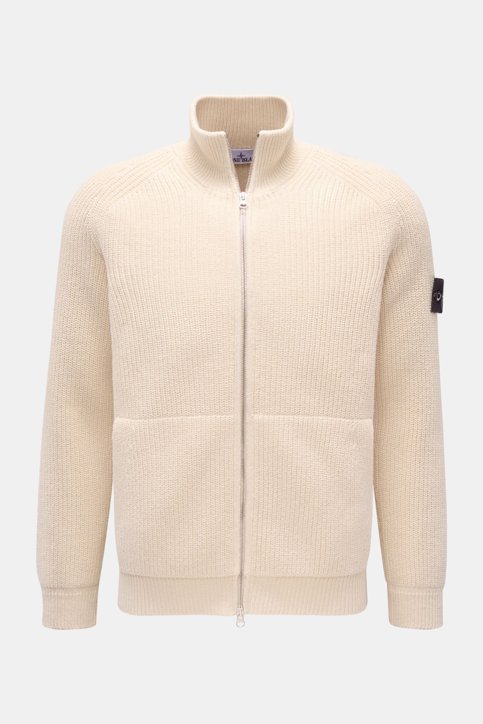 Front view of Stone Island Strickjacke 'Raw Beauty' creme, a slim fit cotton knit cardigan with stand collar, two-way zipper, kangaroo pockets, raglan sleeves, compass badge, and ribbed cuffs.