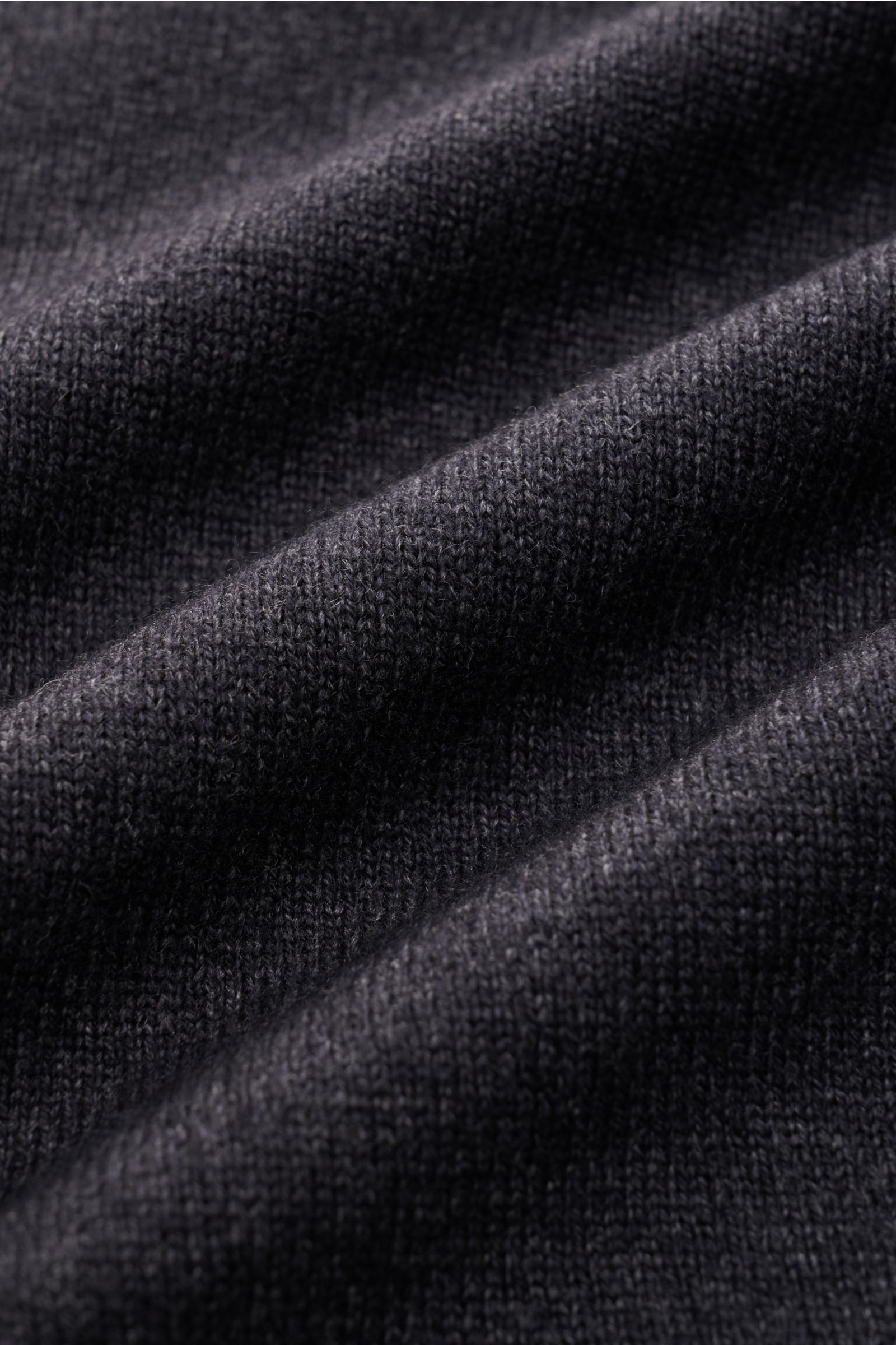 Close-up front view of BRAUN Hamburg Cardigan anthracite mottled fabric showing fine knit texture and soft, warm material.

Timeless elegance meets comfort: This soft and warm cardigan by BRAUN HAMBURG is a versatile layering piece for cold days.
