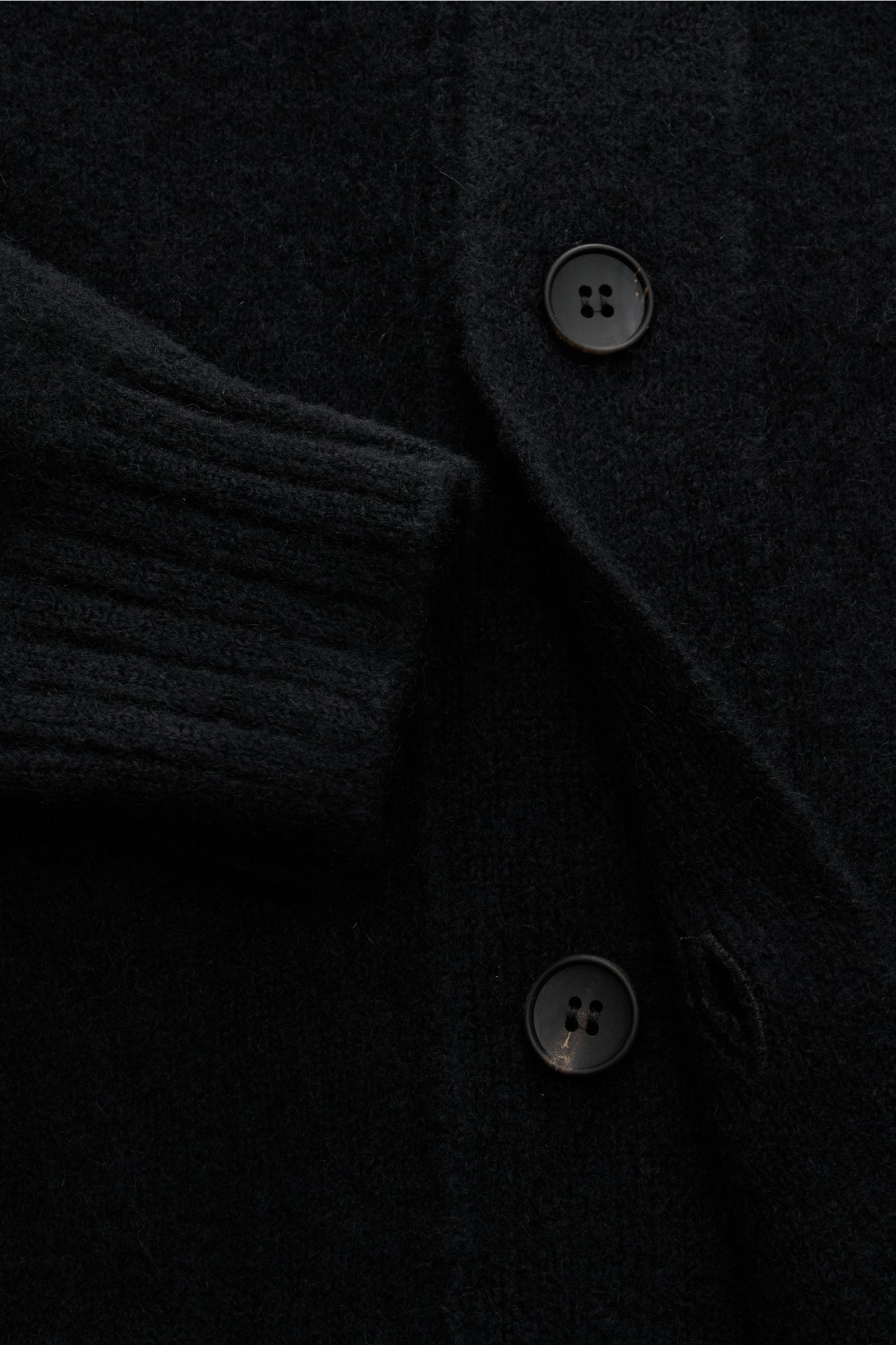 Close-up front view of the Filippo de Laurentiis Cardigan black showing medium-fine knit, five-button placket, and elasticated rib knit cuff.

A soft, luxurious blend of cashmere, silk and high-quality microfibre makes this cardigan by FILIPPO DE LAURE
