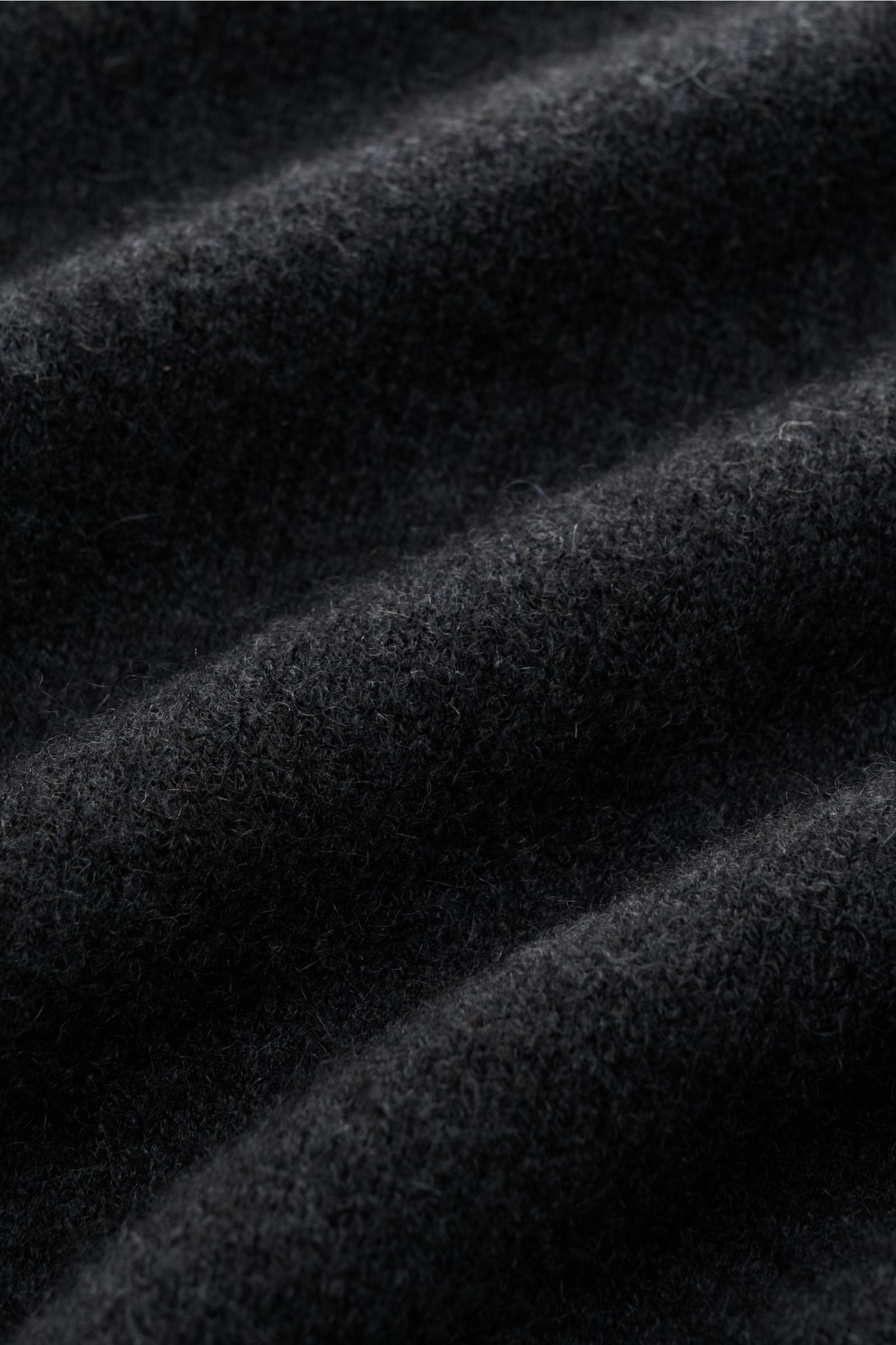 Alt tag (125 characters max): Close-up front view of FTC Cashmere cardigan anthracite showing soft, elasticated fair trade cashmere knit texture.

Description: 
This luxurious cardigan by eco-friendly knitwear label FTC is a soft knitwear essential in 