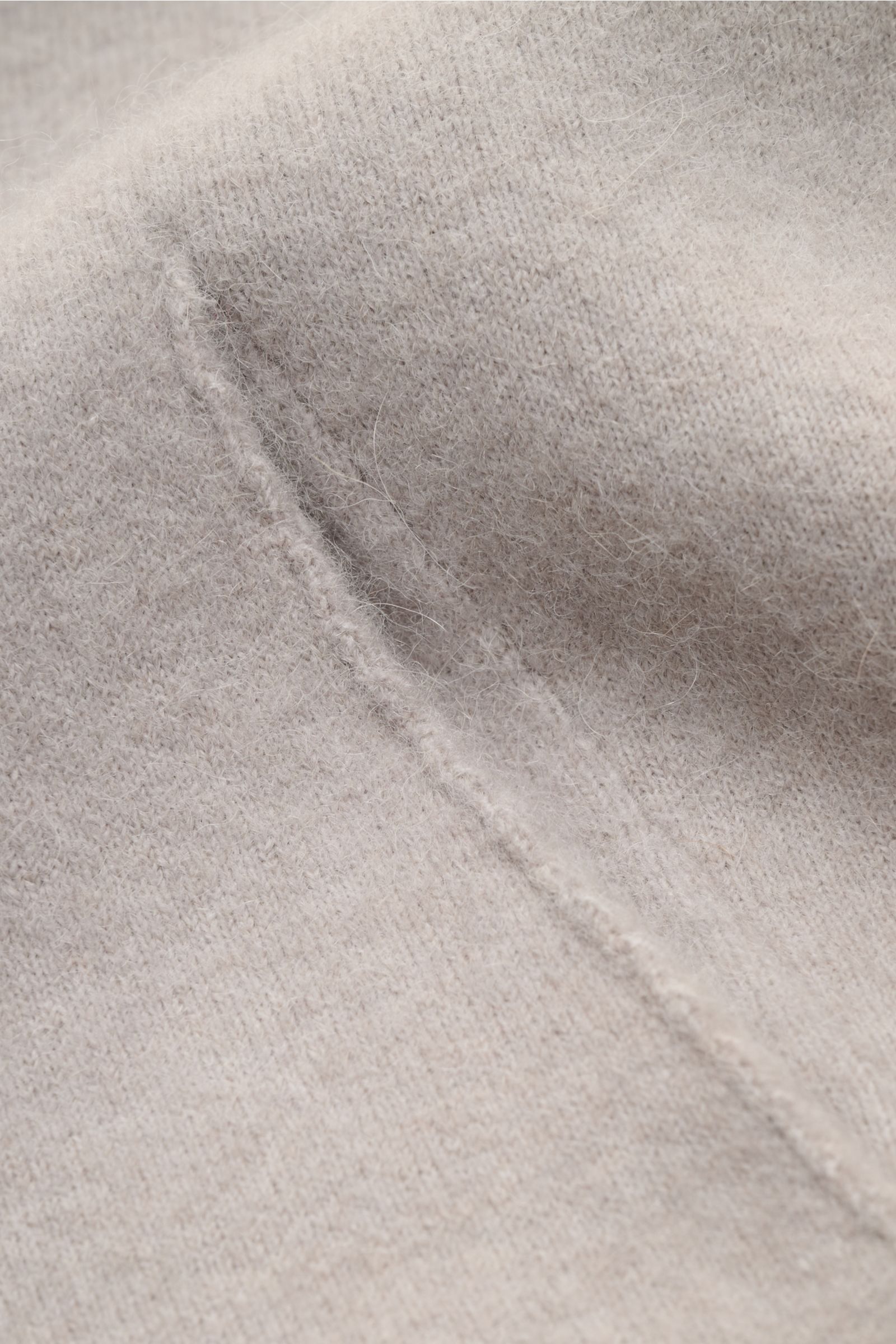 Close-up front view of Kiefermann Strickjacke 'Fabions' hellgrau meliert cardigan showing fine knit texture and seam detail in a warm alpaca-merino blend.