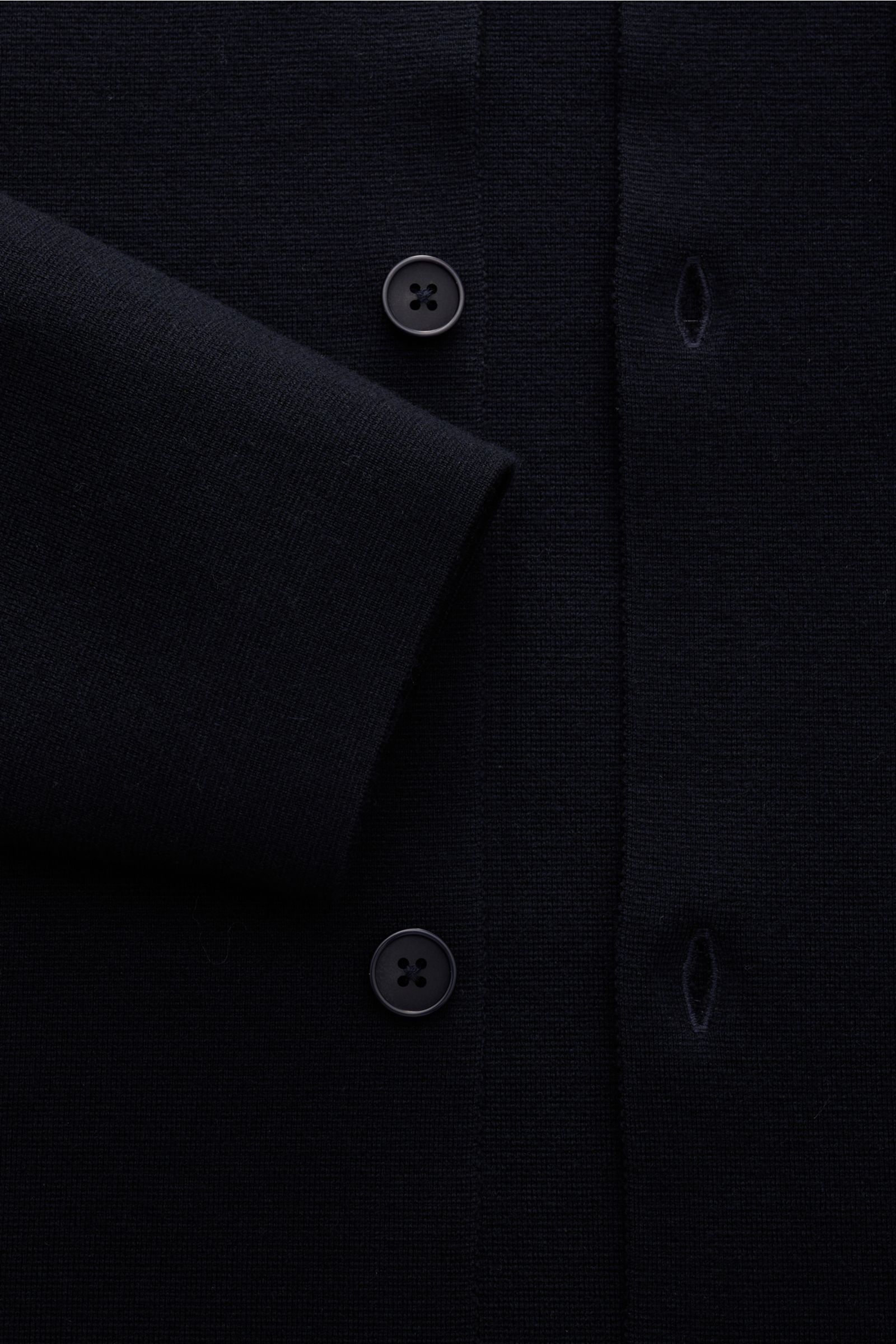 Close-up from above of the Kiefermann Merino Jersey-Cardigan 'Clemenso' hellgrau showing buttons, buttonholes, and sleeve detail, made of pure merino wool jersey with a soft, heavy texture, featuring an open edge finish, regular fit, four-button placket, 
