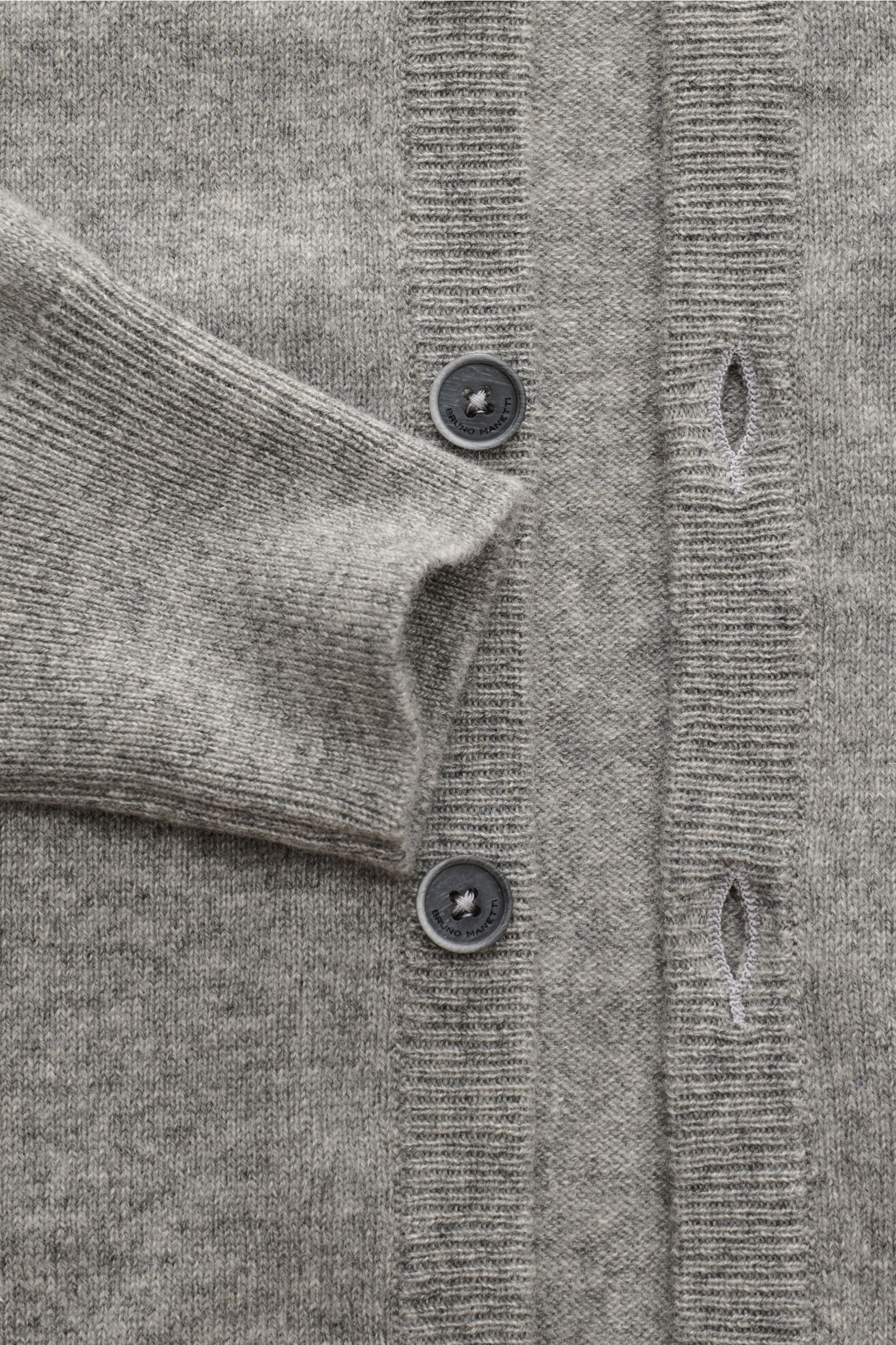 Close-up front view of Bruno Manetti Cashmere cardigan grey melange showing pure cashmere fine knit with soft feel, regular fit, V-neck, six-button placket, and comfortable ribbed bands.