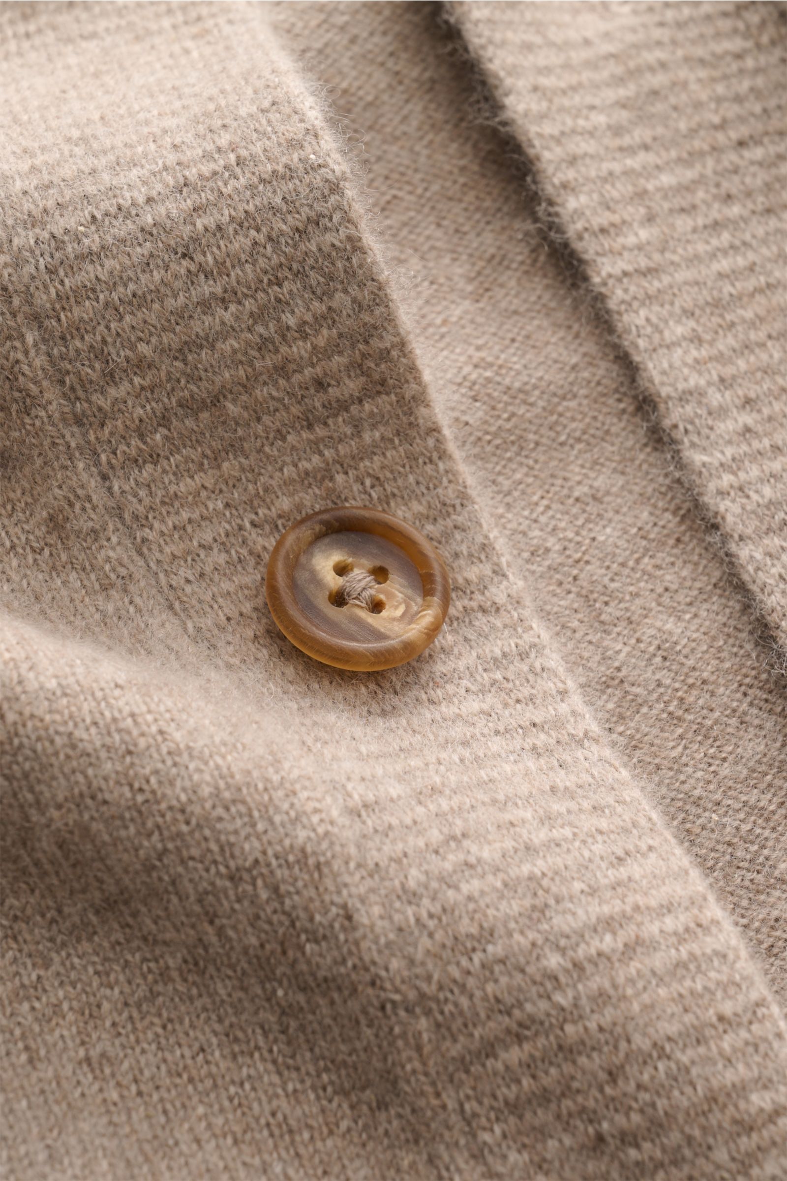 Close-up front view of Fioroni Cashmere cardigan taupe mottled showing fine knit fabric, smooth button placket with brown button, and soft texture. Exquisite craftsmanship from Italy: This cardigan by FIORONI is precisely made from fine material in precio