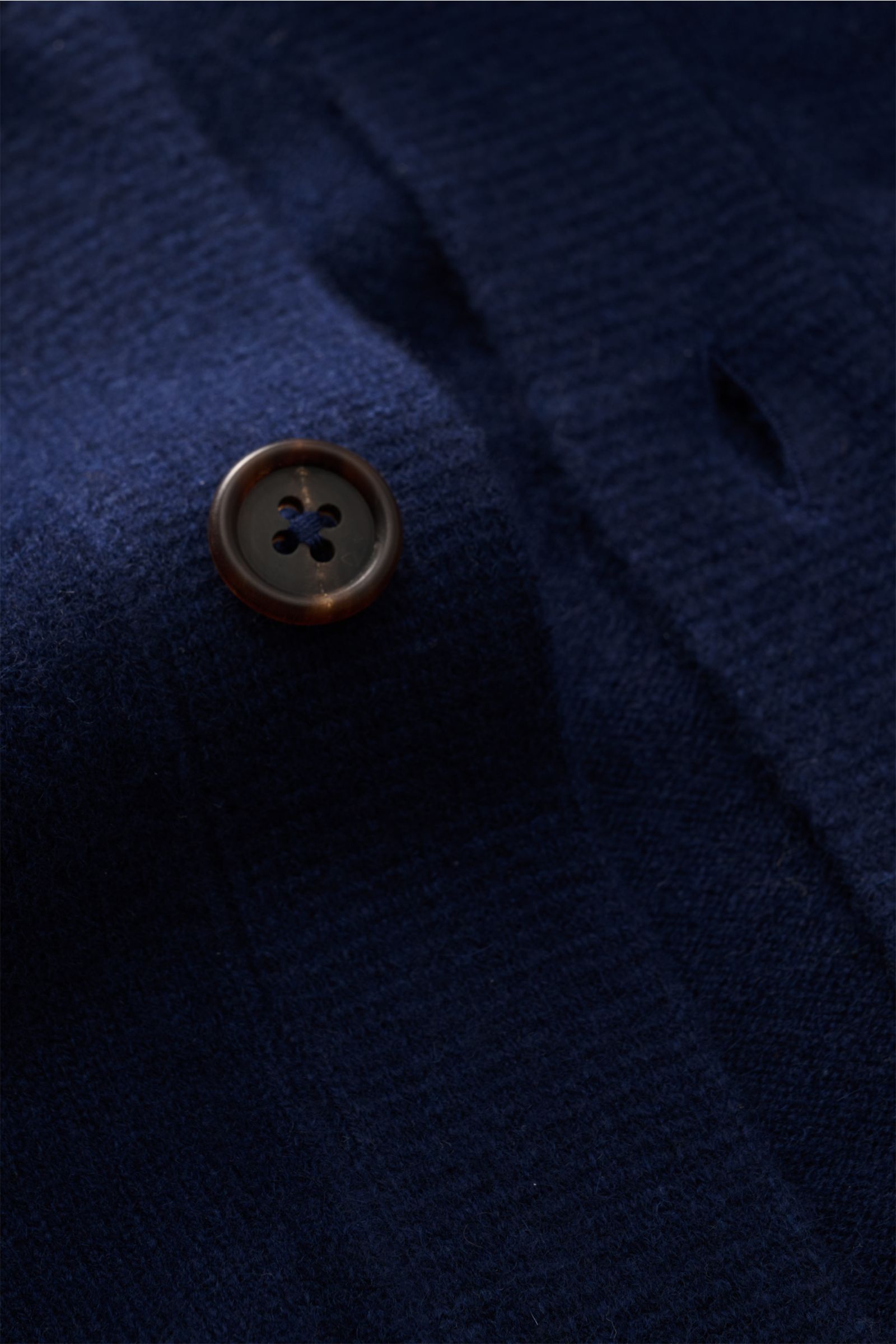 Close-up front view of the Fioroni Cashmere cardigan dark blue showing fine knit, smooth button placket, and flexible ribbed bands, made from pure baby cashmere with a very soft feel. Exquisite craftsmanship from Italy: This cardigan by FIORONI is precise
