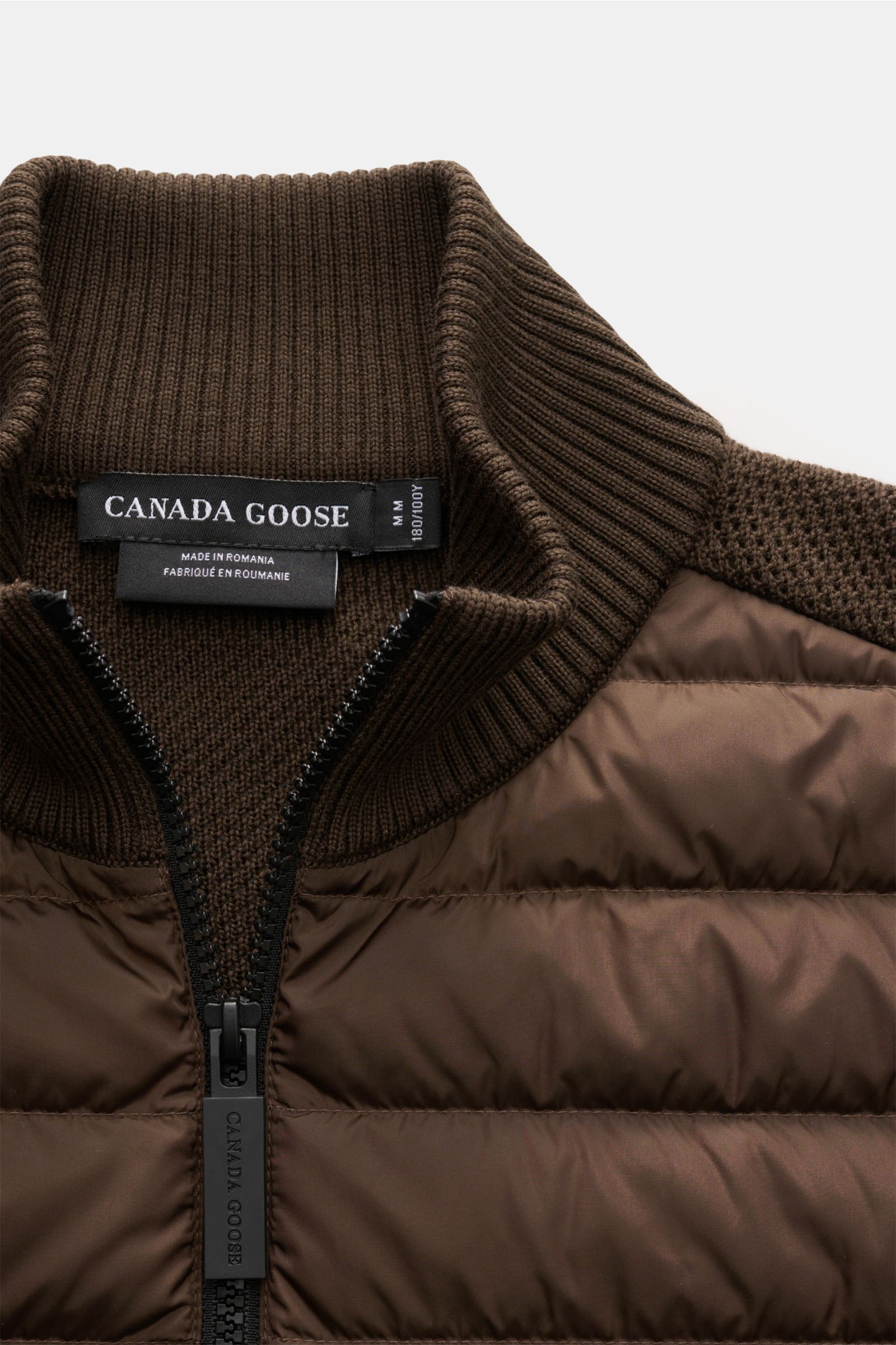 Canada Goose Cardigan 'Hybridge Knit' dark brown shown from close-up front top view, featuring pure wool knit collar and down quilted front. Make a smooth transition into the new season with the cardigan 'Hybridge Knit' from the outdoor label CANADA GOOSE