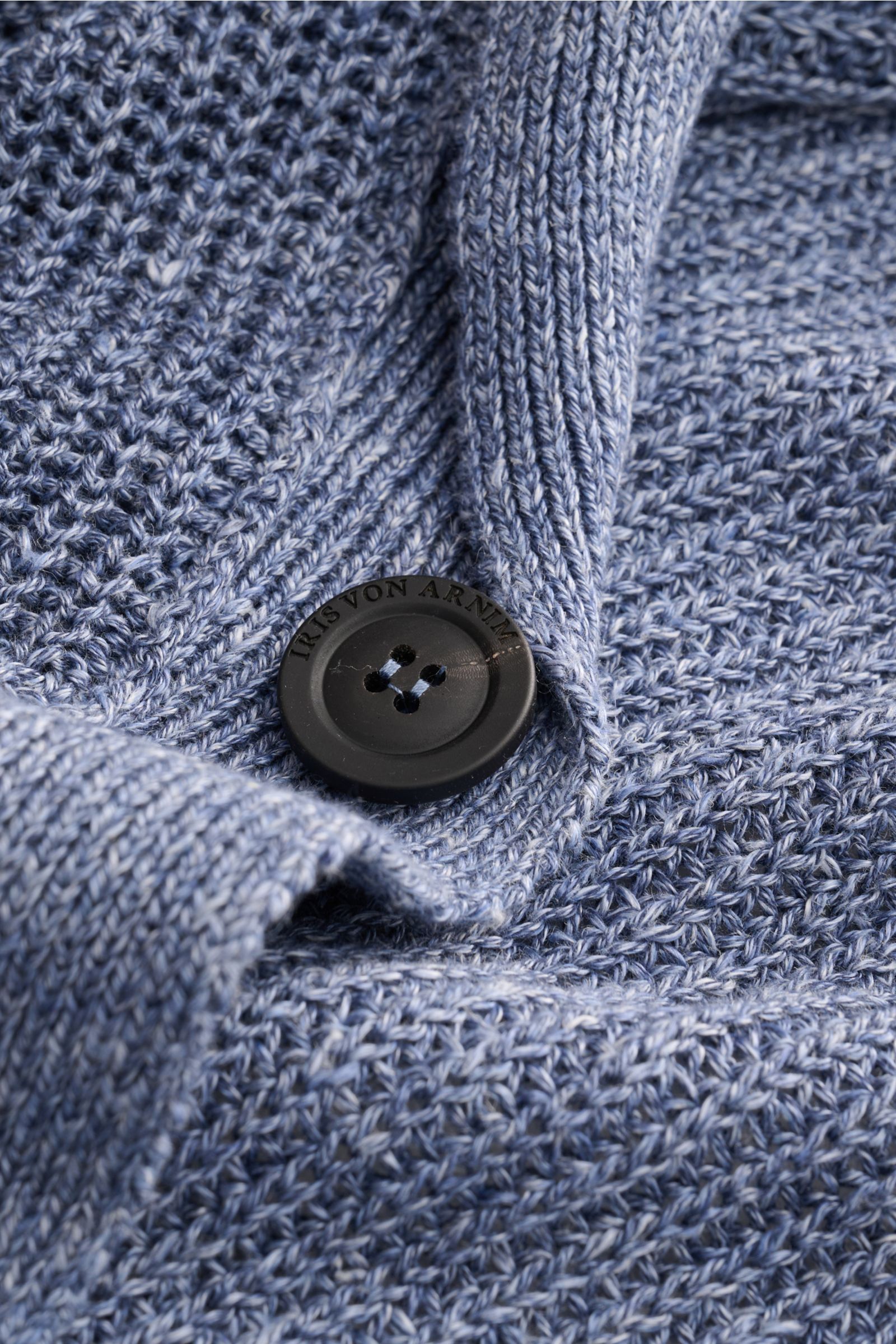 Close-up front detail of Iris von Arnim Cardigan 'Larion' smoky blue mottled showing voluminous brioche knit and branded button.

A luxurious knitwear essential: With its voluminous brioche knit in the finest linen-cotton blend, this cardigan by IRIS V