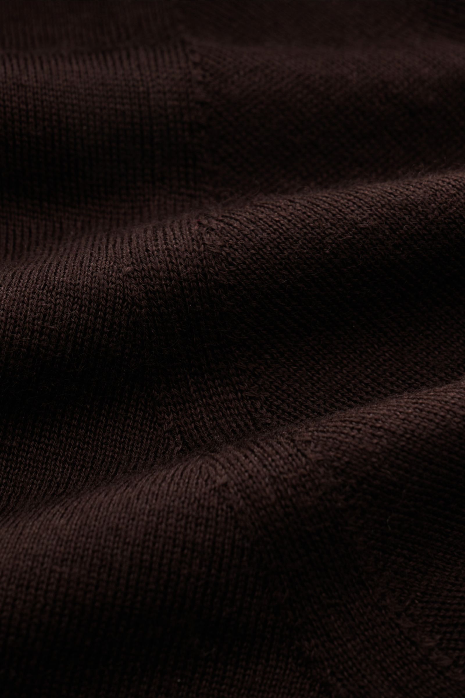 Close-up front-angle view of Bruno Manetti Cashmere silk cardigan dark brown, showing fine knit texture and soft fabric folds.  

Description: Luxury you can feel on your skin: This fine knit cardigan by BRUNO MANETTI has 
