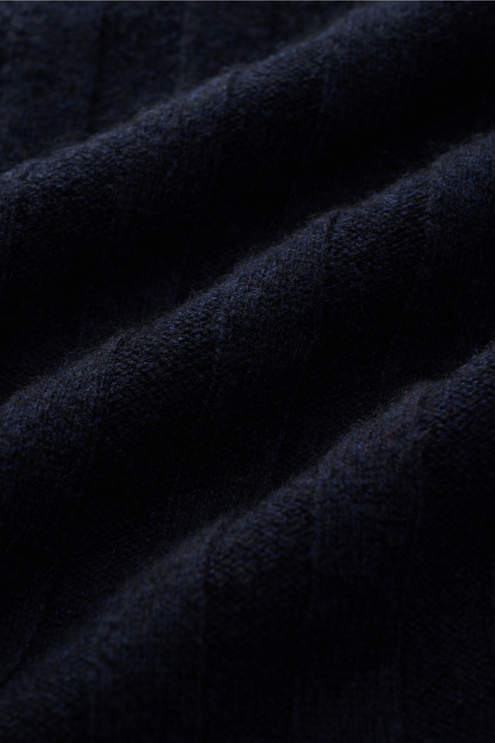 Alt tag (125 characters max):
Close-up front view of FTC Cashmere cardigan navy showing soft, fine, wide rib knit texture in deep navy blue fabric.

Description:
This luxurious cardigan by environmentally friendly knitwear label FTC is a soft essential