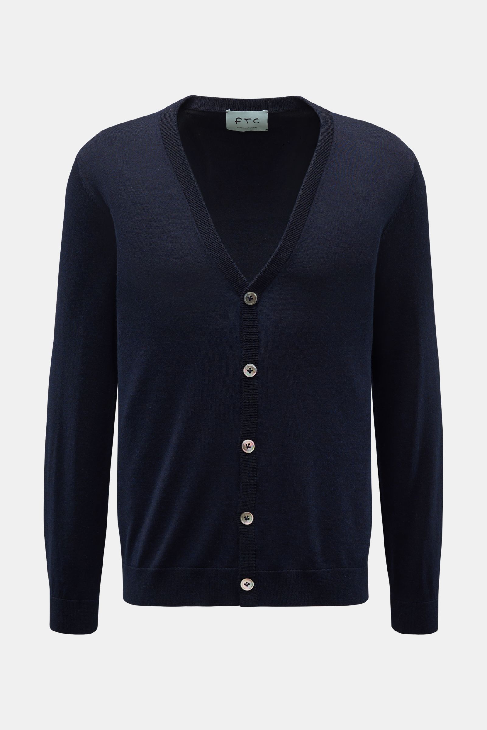 Front view of FTC Cardigan navy, a slim-fit V-neck cardigan with five buttons, ribbed bands, made of soft fair trade cashmere and SeaCell blend.

This luxurious cardigan by eco-friendly knitwear label FTC is a soft knitwear essential made of fair trade