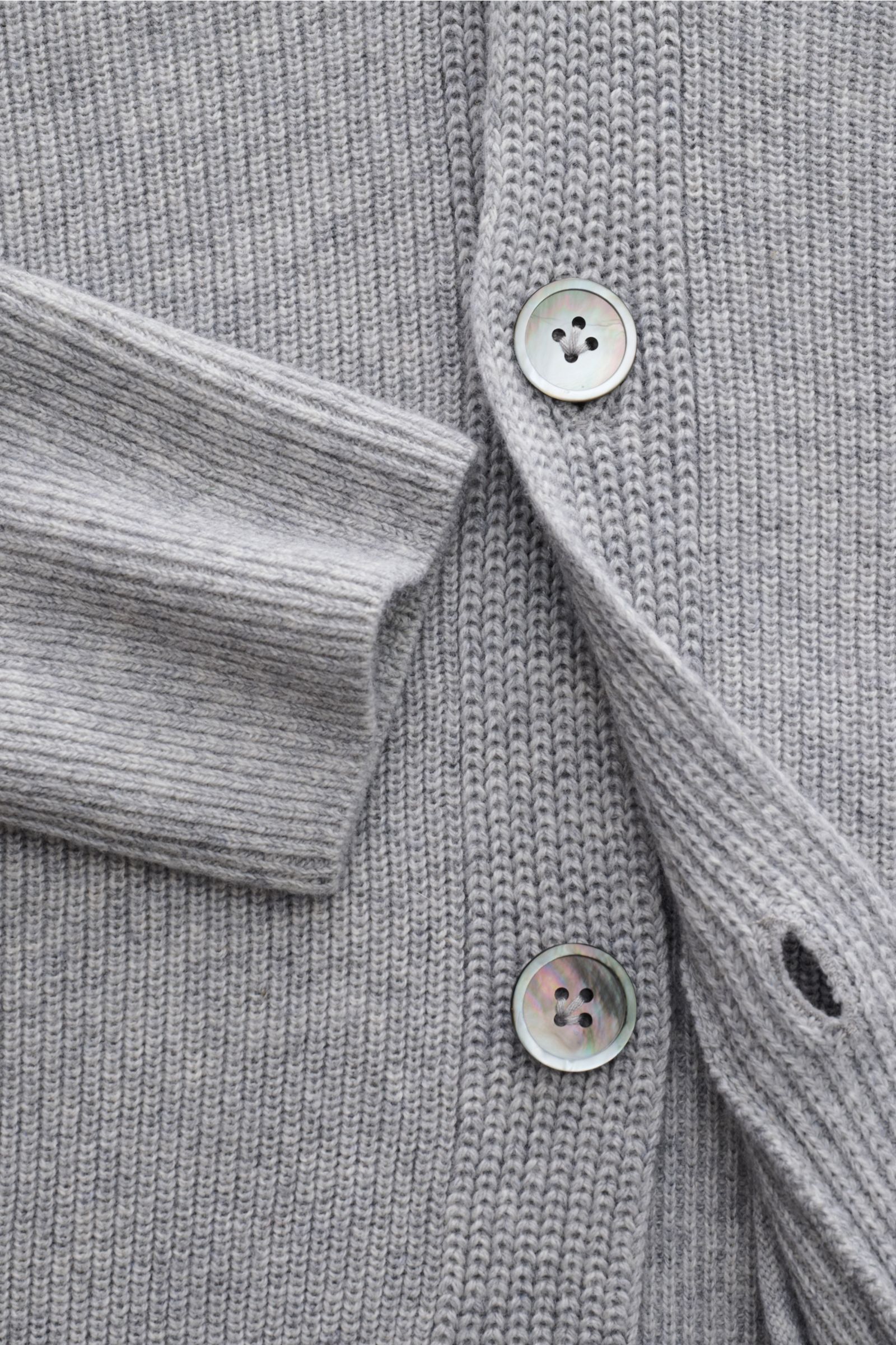 Alt tag (125 characters max): Close-up front view of FTC Cardigan grey showing buttons, ribbed cuff, and medium-fine knit texture in soft cotton-cashmere.

Description:
This luxurious cardigan from sustainable knitwear label FTC is a classic knitted es