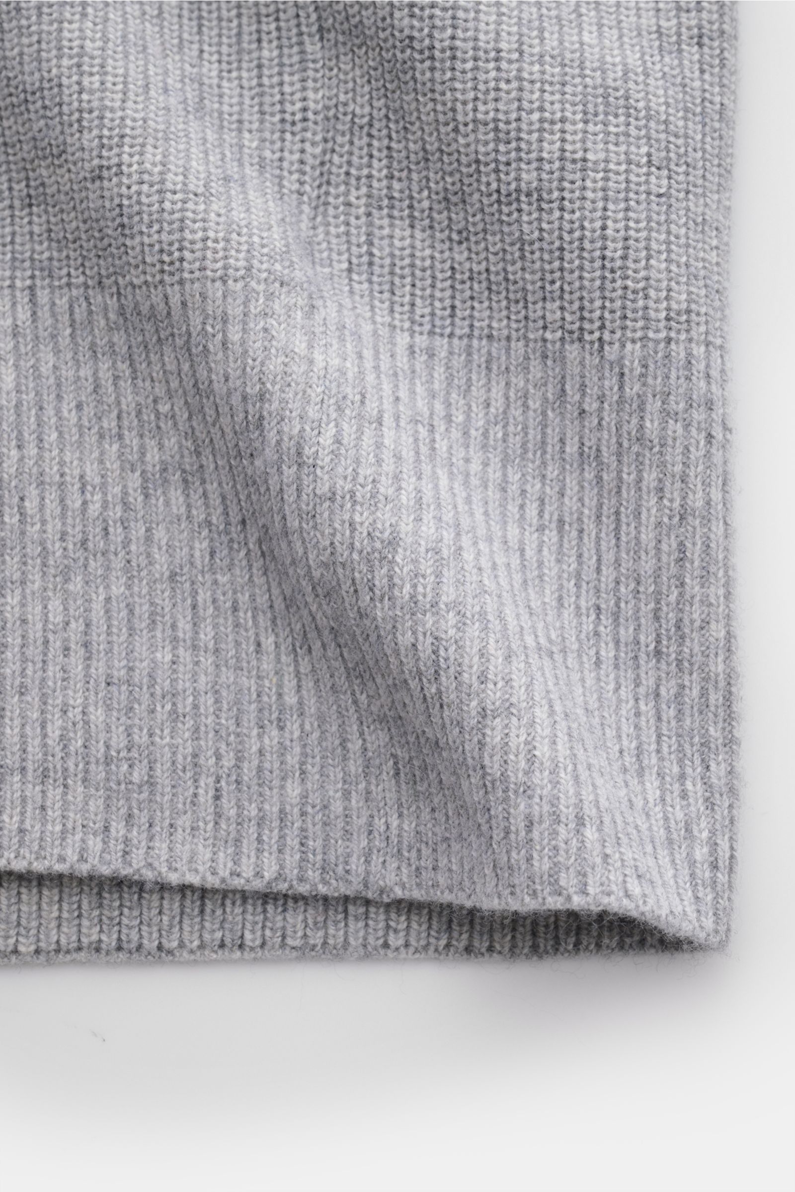 Close-up front view of FTC Cardigan grey showing medium-fine knit texture and ribbed bands.

This luxurious cardigan from sustainable knitwear label FTC is a classic knitted essential made from cotton and fair trade cashmere – and a must-have in any ca