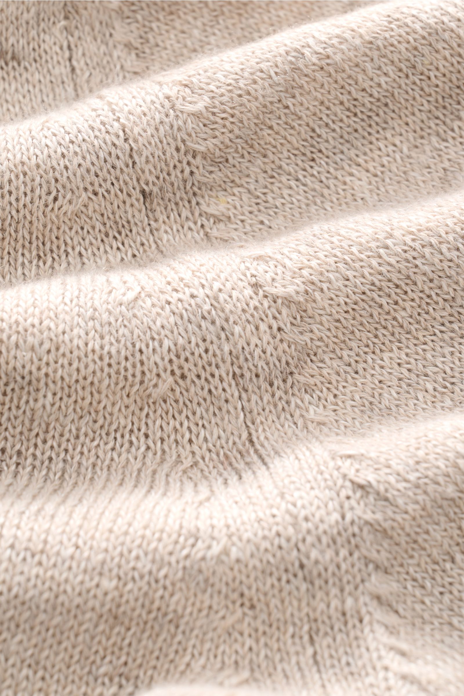 Close-up front view of the Filippo de Laurentiis Cardigan beige meliert showing fine, lightweight knit texture. Stylish and effortless with a light mix of linen and cotton, this cardigan features a soft touch, regular fit, five-button placket, patch hip p
