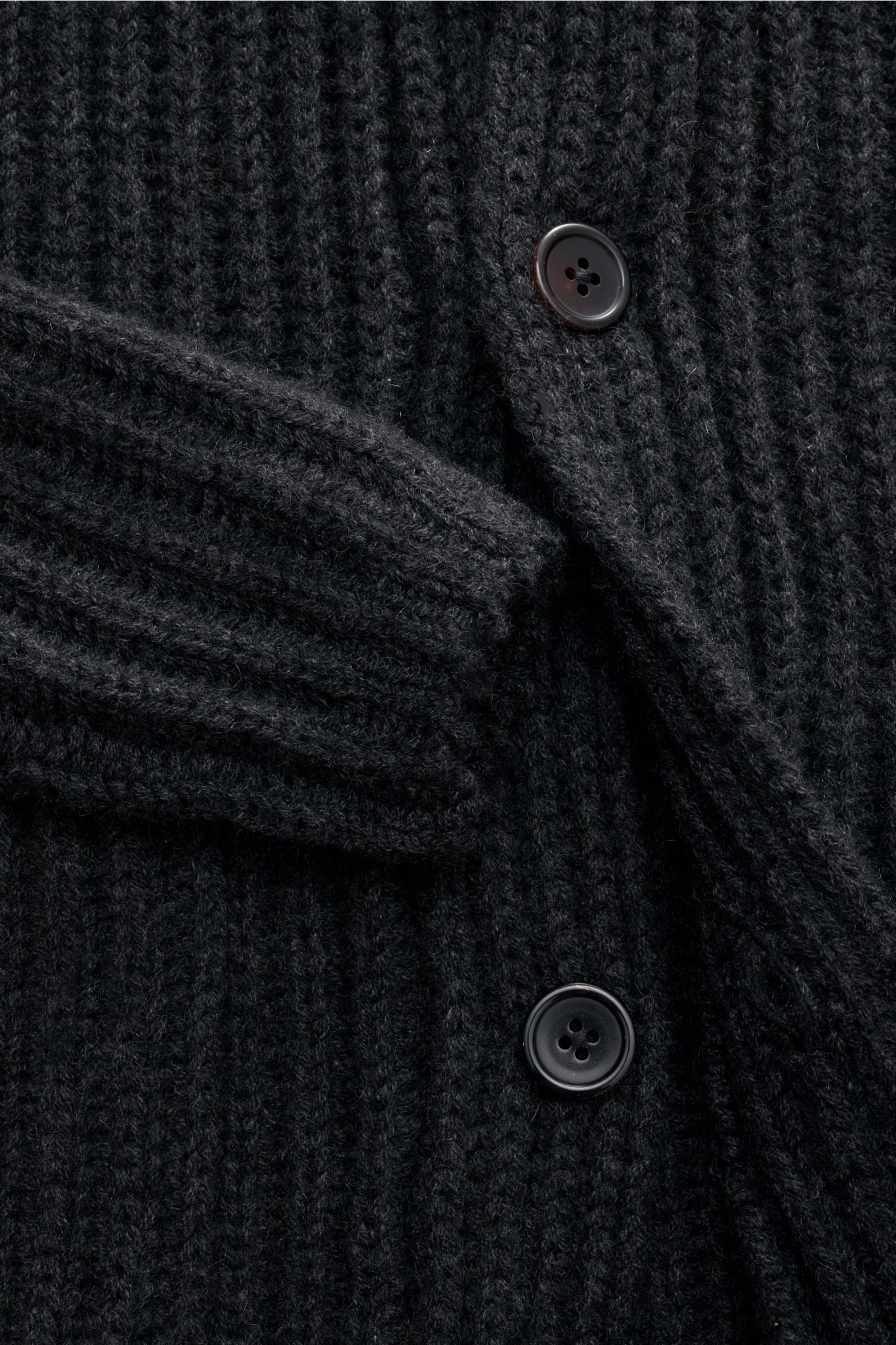 Close-up front view of the von Braun Cashmere cardigan anthracite mottled showing chunky brioche stitch knit, shawl collar, and four-button placket. How about a less chunky knit? This cardigan in brioche stitch from the VON BRAUN Cashmere collection is yo
