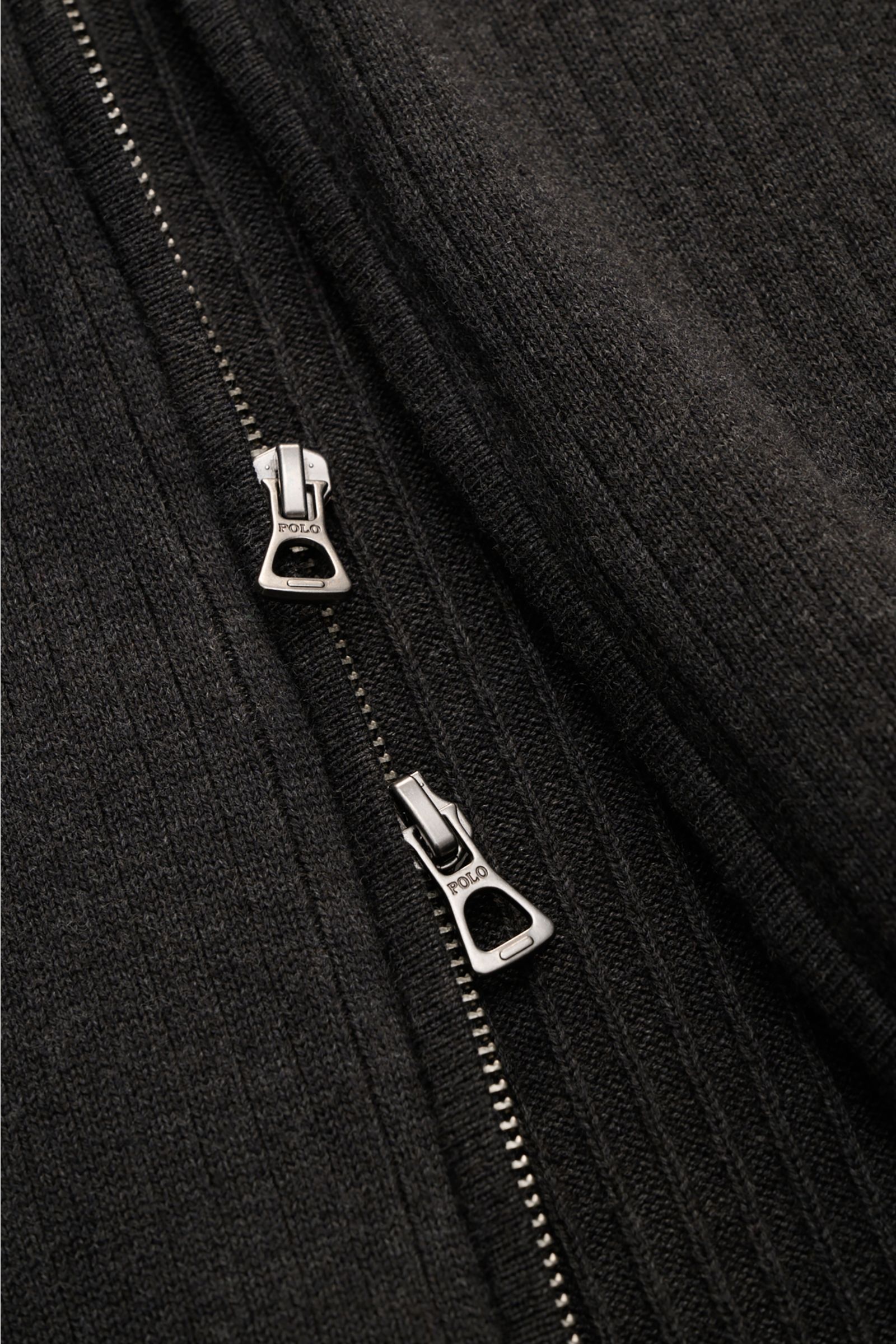Close-up front view of the Polo Ralph Lauren Cardigan anthracite showing ribbed pure cotton fabric and concealed two-way zip with POLO engraved pulls.

This ribbed cardigan in pure cotton by POLO RALPH LAUREN adds an extra layer of comfort from spring 