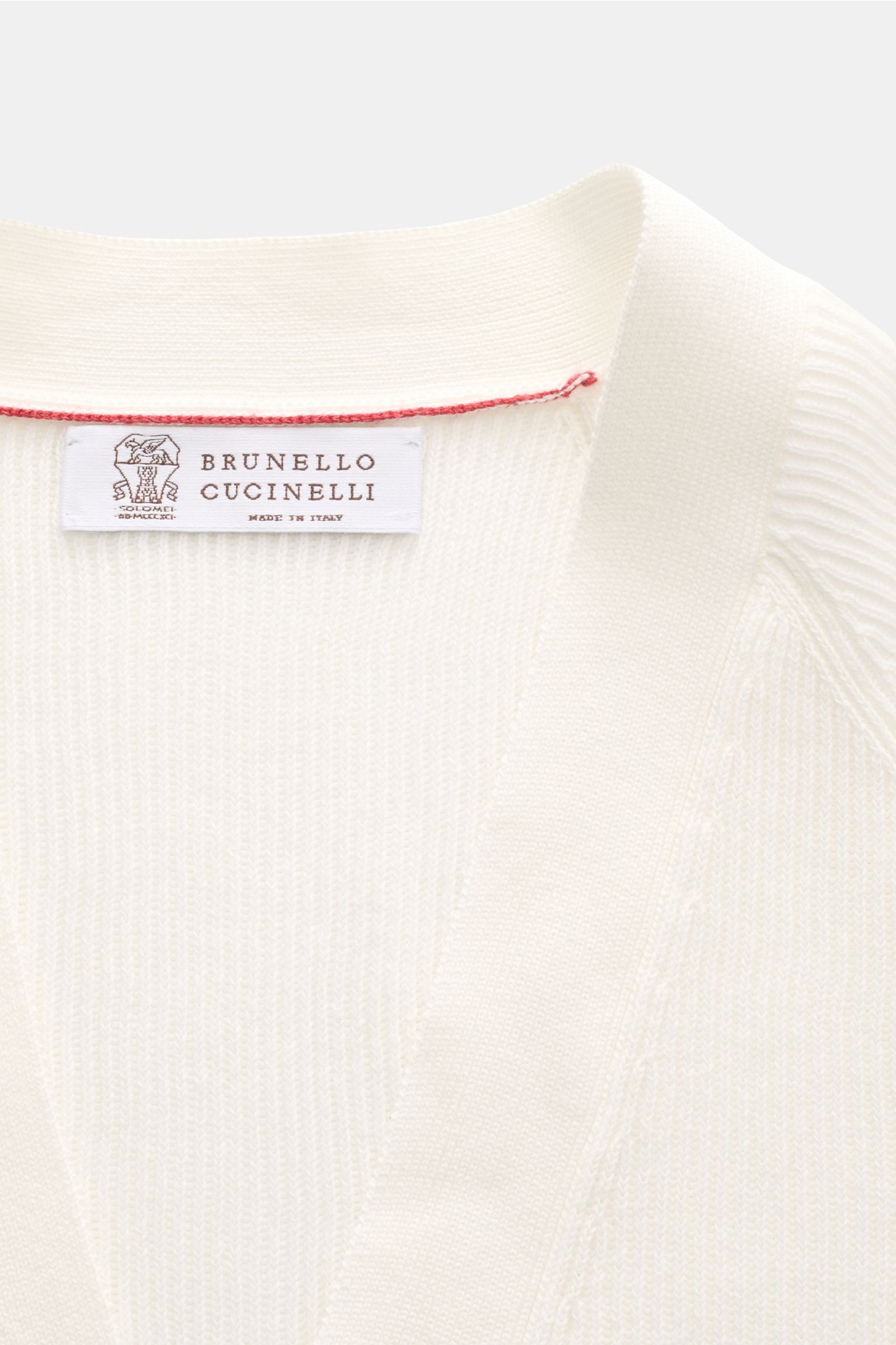 Close-up front view of Brunello Cucinelli Cardigan off-white showing fine brioche knit and label.

Description: Luxury for the office and your downtime: This cardigan in fine brioche knit in soft cotton enhanced with crest buttons by BRUNELLO CUCINELLI