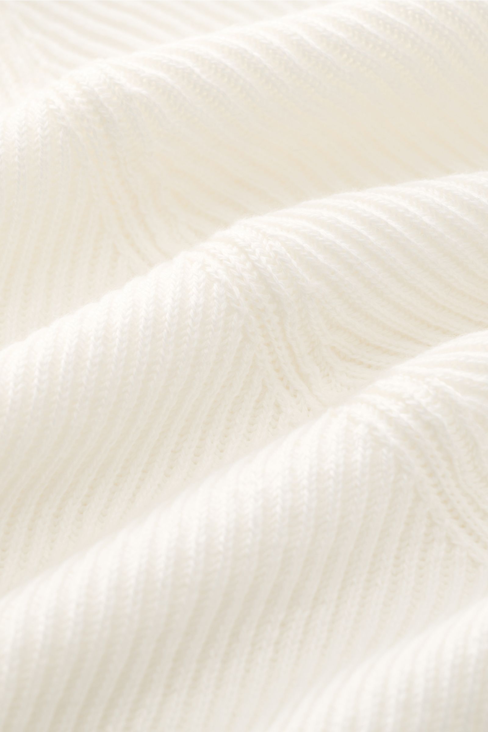 Close-up front-angle view of the off-white Brunello Cucinelli Cardigan showing fine brioche knit texture and soft cotton fabric.

Luxury for the office and your downtime: This cardigan in fine brioche knit in soft cotton enhanced with crest buttons by 