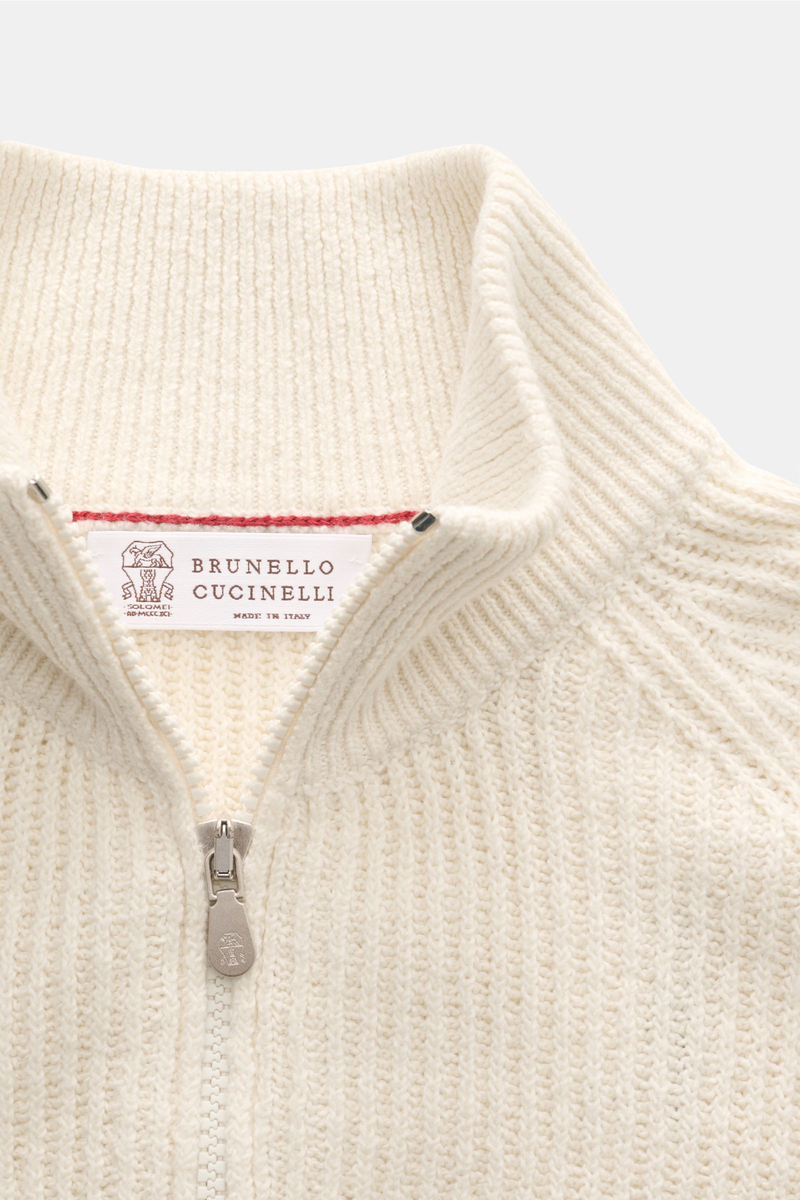 Close-up front view of the Brunello Cucinelli Cardigan cream showing the close-fitting standing collar and two-way zip in soft cotton brioche knit.

BRUNELLO CUCINELLI adds luxury to your casual wardrobe with this cardigan in brioche knit in soft cotto