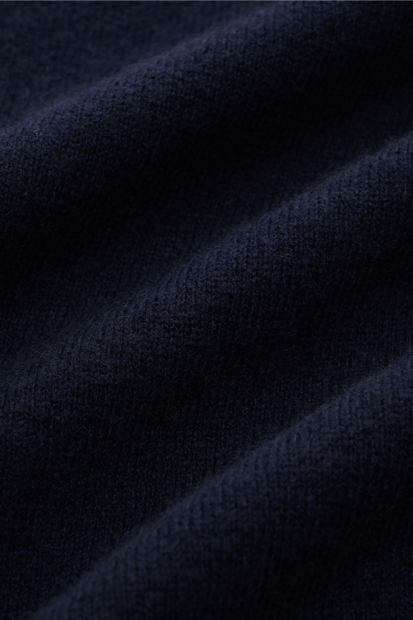 Close-up front view of Lisa Yang Cashmere cardigan 'Lance' navy fabric showing medium-fine knit texture in pure cashmere.

Contemporary design by LISA YANG: With this straight-cut cardigan in a heavy fabric made from pure cashmere, you can style clean 