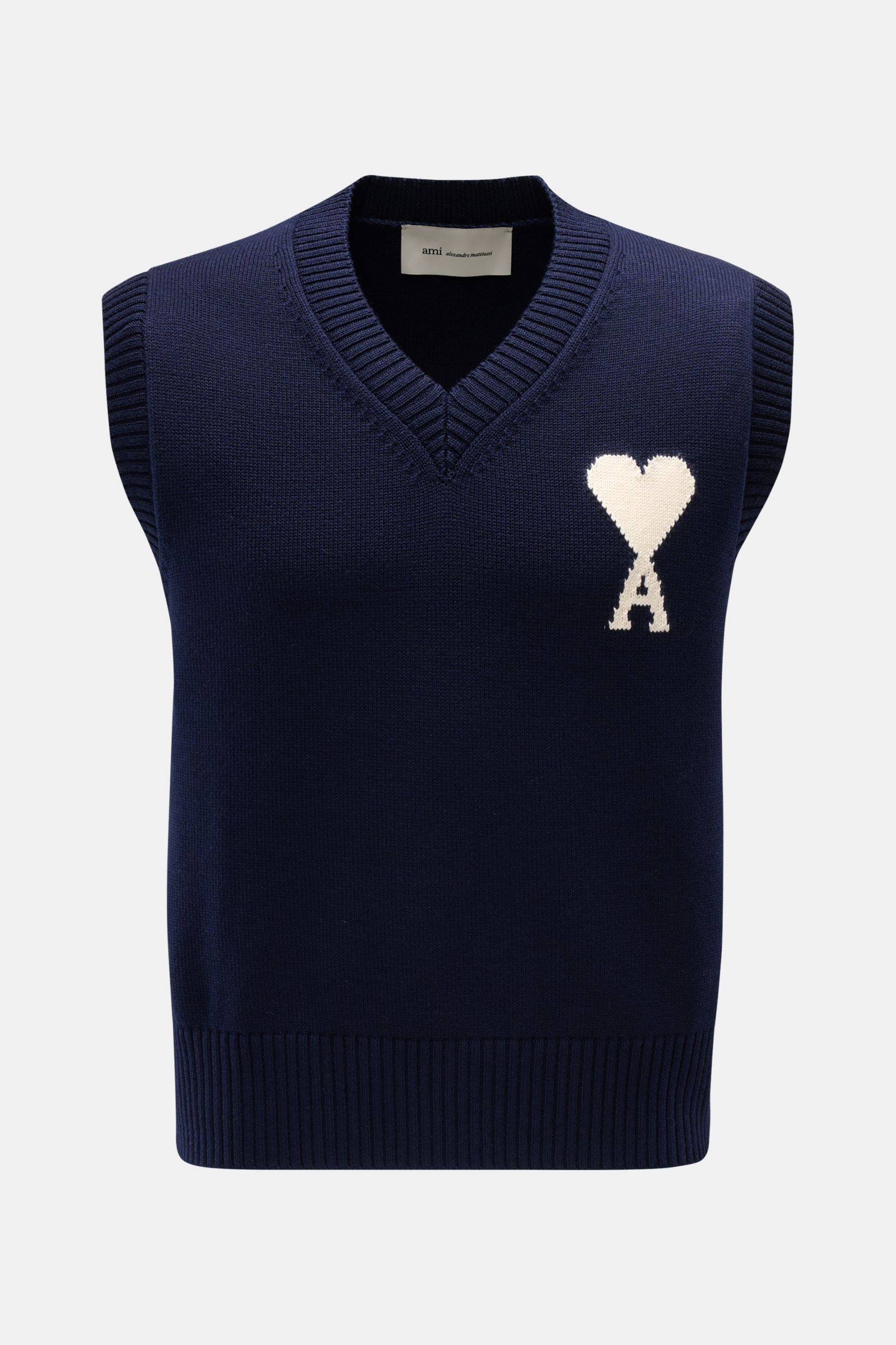 Front view of Ami Paris V-Neck Pullunder navy, a slim fit sleeveless layering piece in wool and cotton with a soft feel and ribbed edges.

Description: Layering-Piece von AMI PARIS: Der ikonische Pullunder mit V-Neck und typisch abgestepptem 'Ami'-Logo