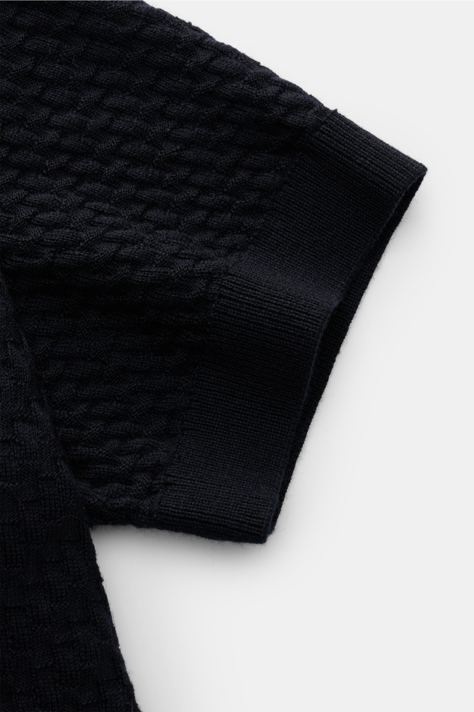 Alt tag (125 characters): Close-up side view of Emporio Armani Short sleeve jumper navy showing textured knit and ribbed sleeve detail in pure virgin wool.

Versatile companion: This lightweight short sleeve jumper in pure virgin wool by EMPORIO ARMANI