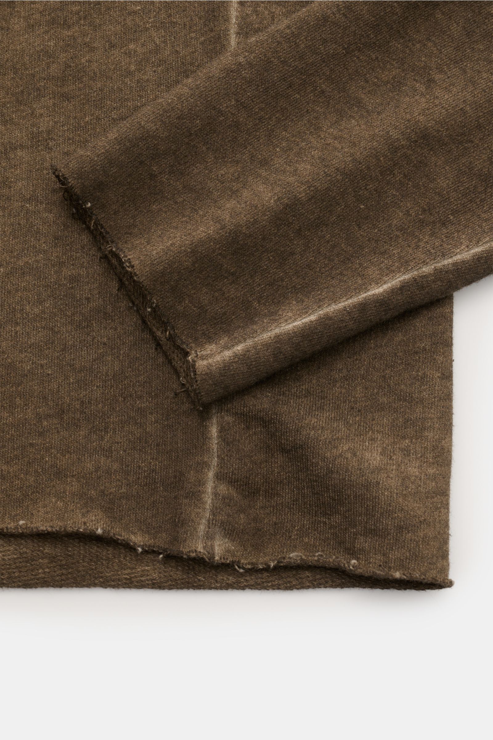 Kiefermann Crew neck sweatshirt 'Achko' dark olive mottled shown from close-up side angle, highlighting raw edges on hem and sleeve, soft garment-dyed cotton with slim fit and dividing seam on back. 

The crew neck sweatshirt 'Achko' by KIEFERMANN is t