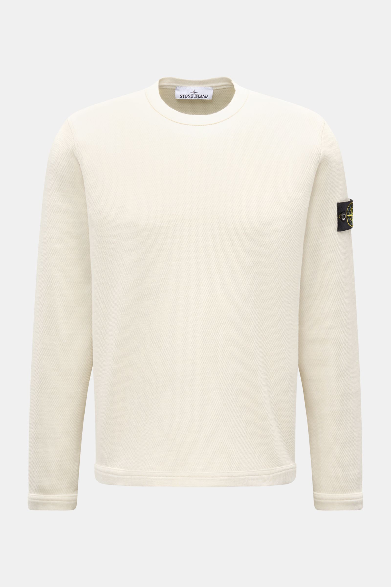 Stone Island Rundhalspullover creme, frontale Nahaufnahme, reine Baumwolle, strukturierte Jersey-Qualität, Overlock-Nähte, Kompass-Badge am Oberarm.