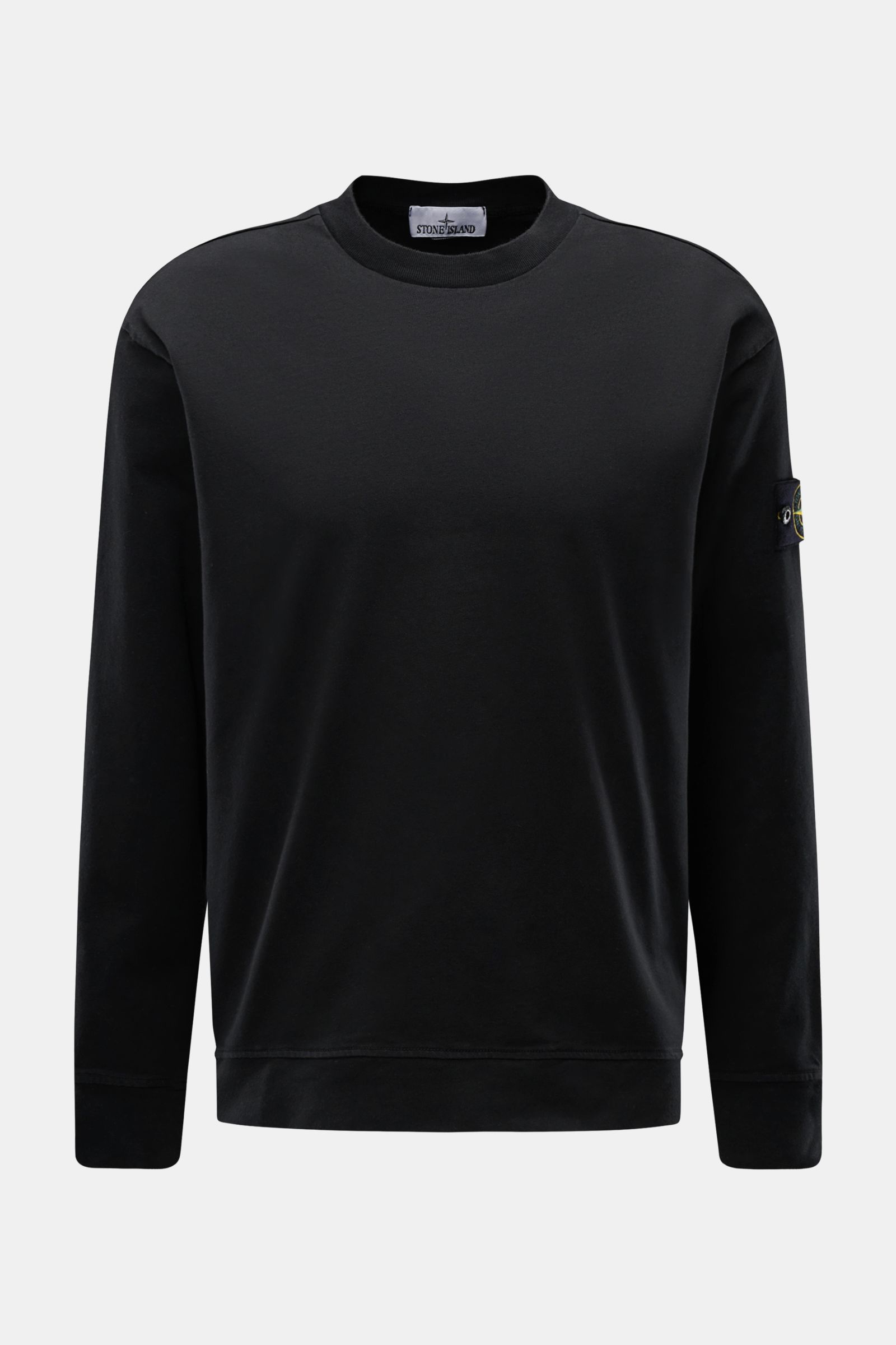 Front view of Stone Island Long sleeve black crew neck sweatshirt in heavy cotton jersey with compass badge on the sleeve.

Description: 
With this crew neck long sleeve in heavy cotton jersey with compass badge on the sleeve, STONE ISLAND brings us a 