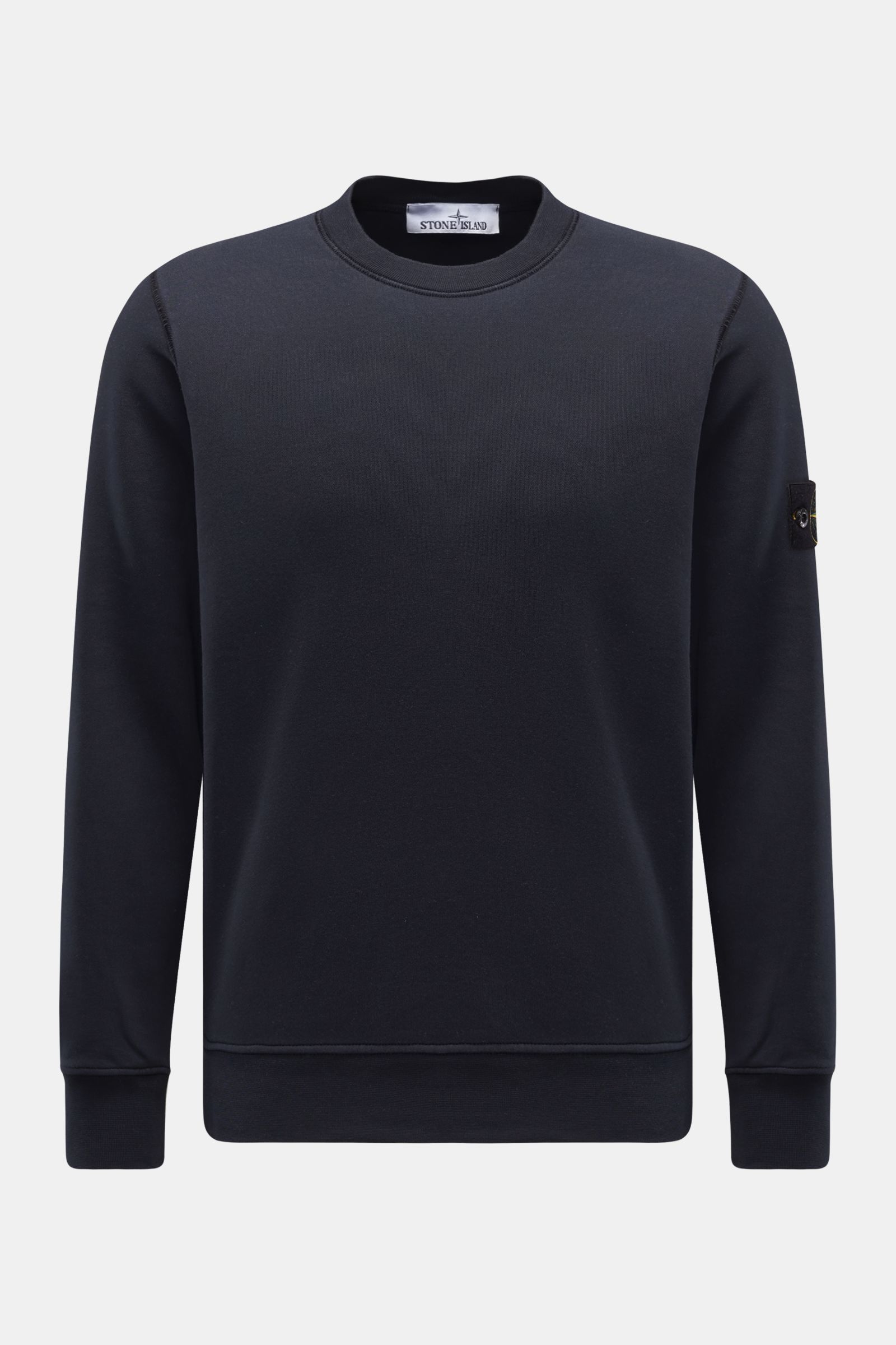 Front view of Stone Island Crew neck sweatshirt 'Basic Sweat' navy, a pure cotton, soft, regular fit sweatshirt with ribbed bands and compass badge on upper sleeve.

Description: 
A timeless basic piece: This sporty sweatshirt by STONE ISLAND provides 