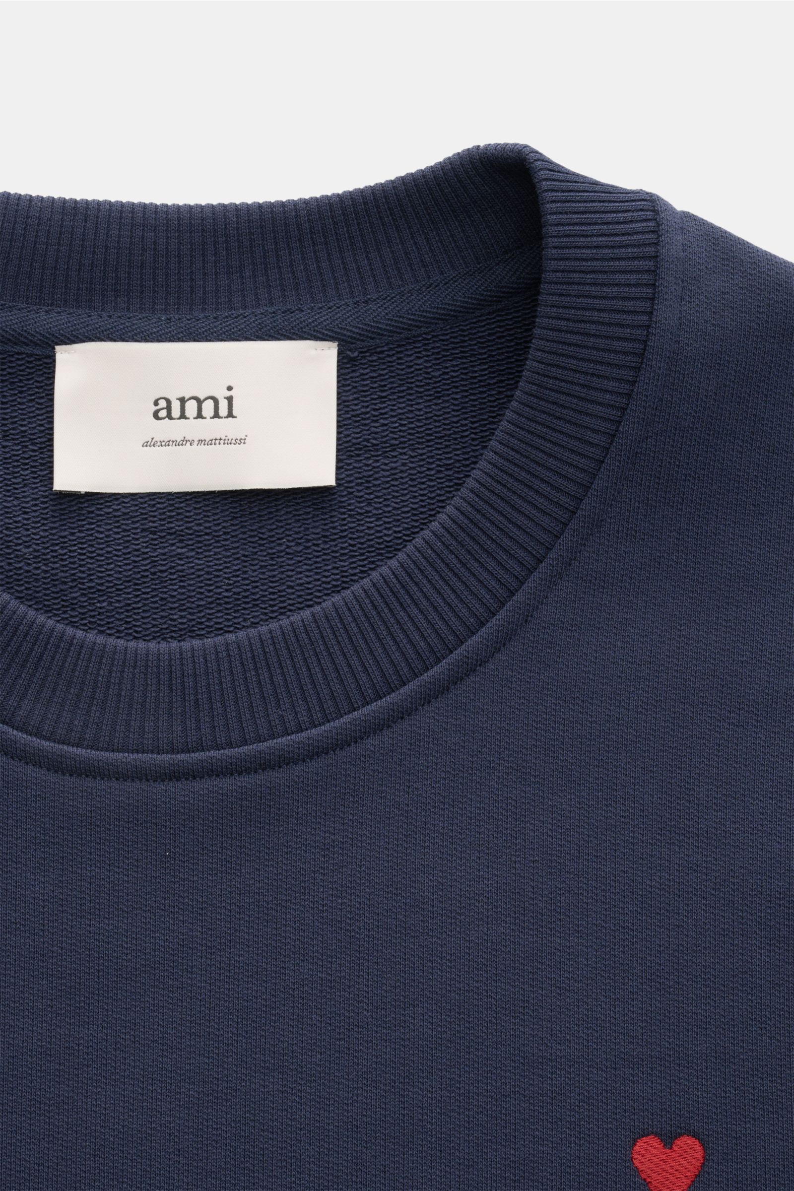 A close-up front view of the Ami Paris Crew neck sweatshirt navy showing the ribbed crew neck, logo stitching on the chest, and soft pure cotton fabric. 

Comfortable basic: The AMI PARIS sweatshirt in pure cotton is the ideal companion for sporty look