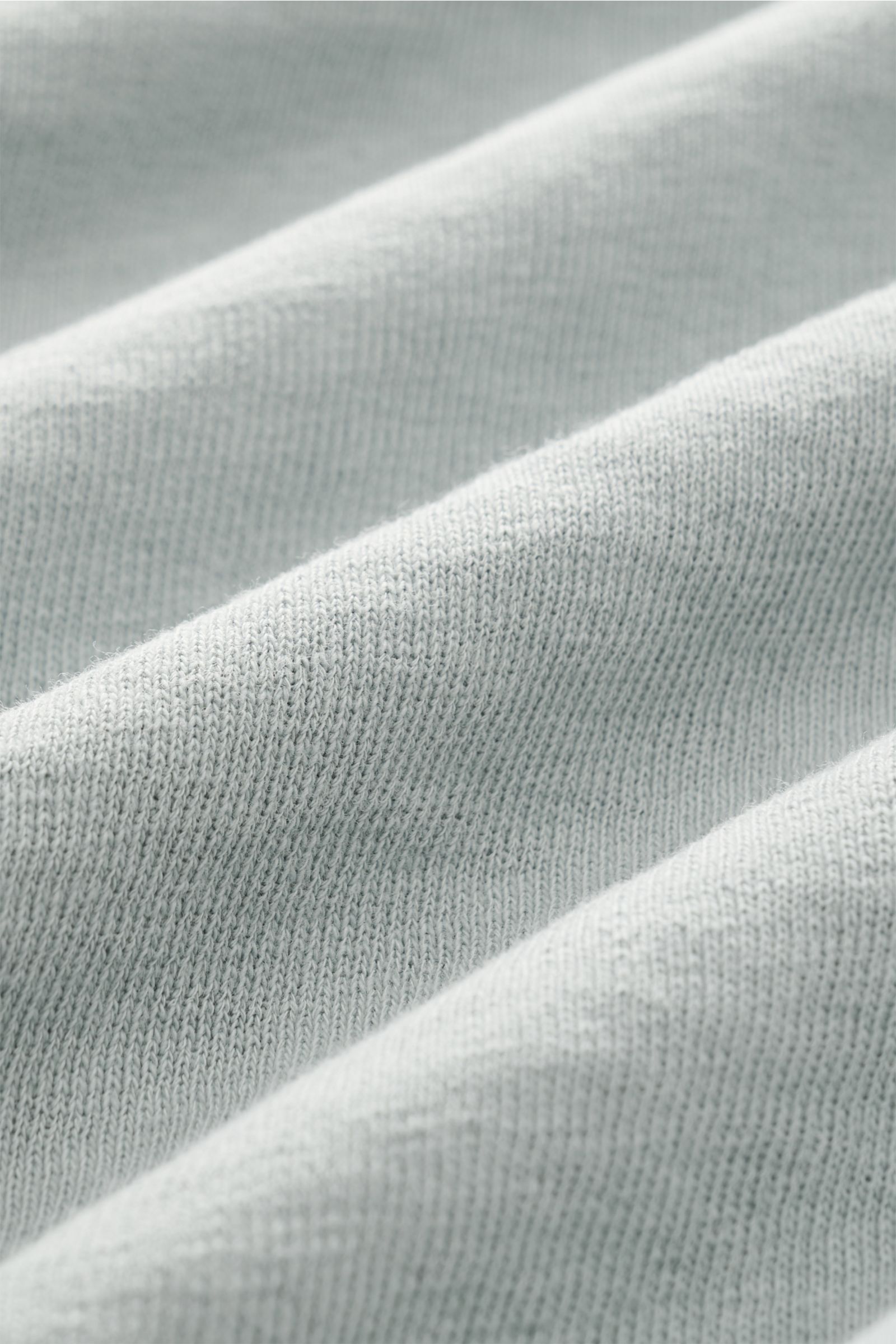 Close-up front view of C.P. Company Crew neck sweatshirt grey-green showing garment-dyed pure cotton fabric with fine knit texture and soft folds. 