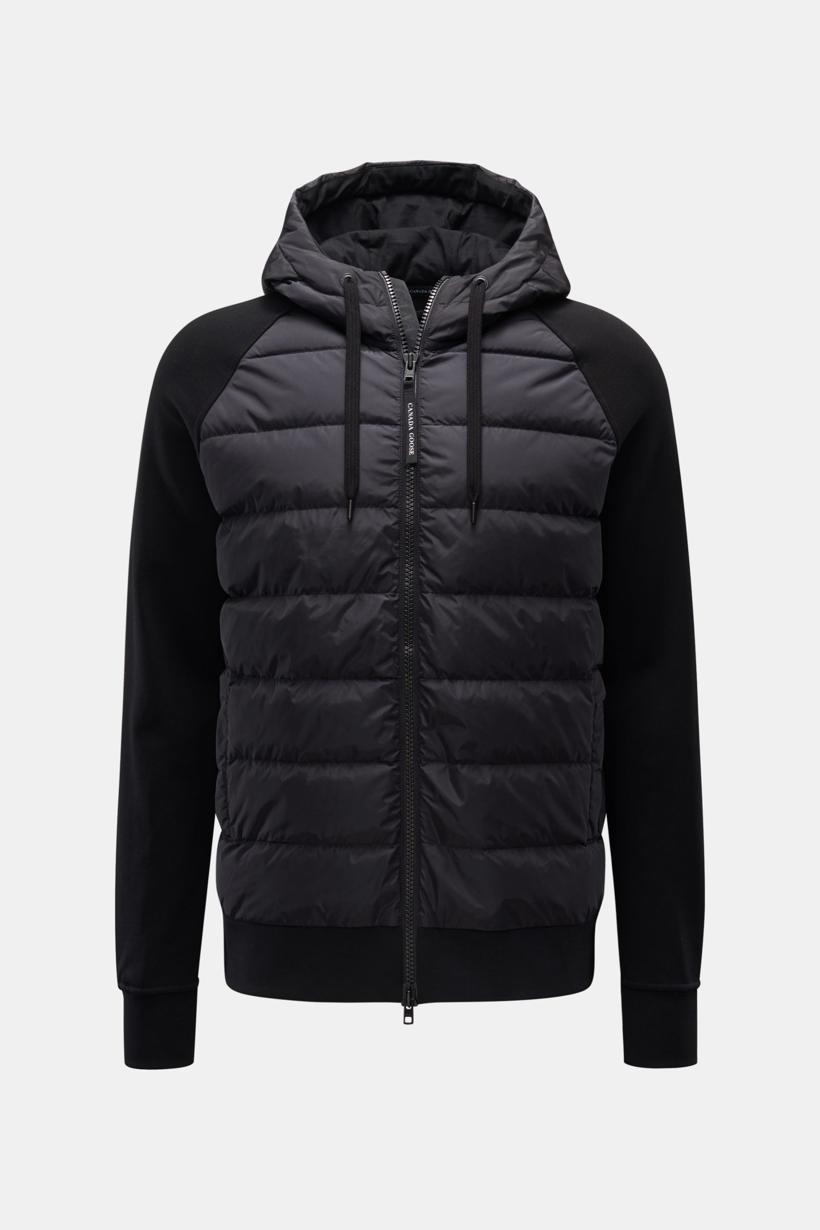 Front view of the Canada Goose Sweatjacke 'HyBridge Huron' schwarz, a mid-weight hybrid hooded jacket with raglan sleeves, soft cotton sweat fabric, down-filled front and hood, two-way zipper, drawstring hood, snap-button side welt pockets, Canada Goose l